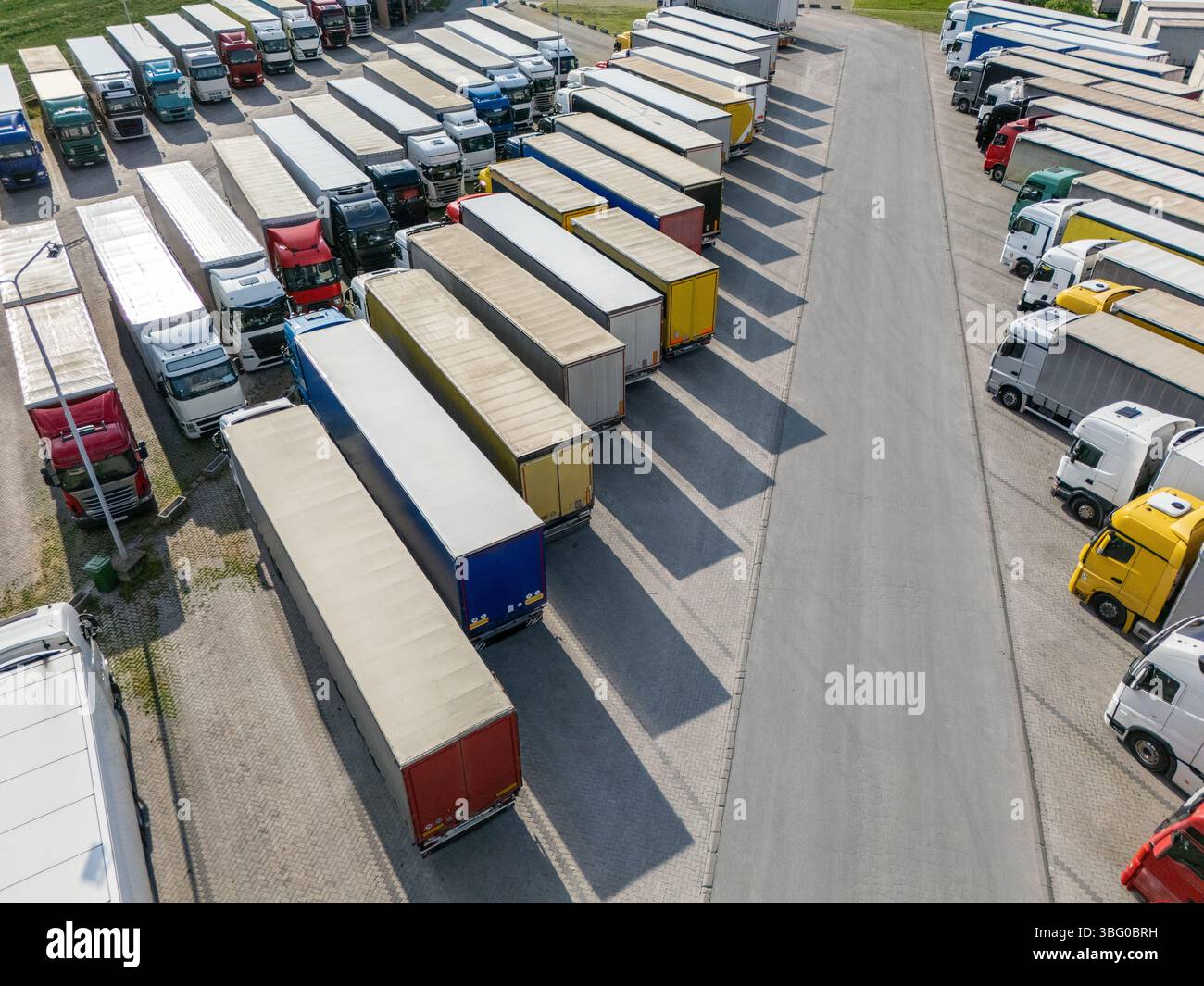 Aerial view of a large truck parking lot at a logistics hub, with ...