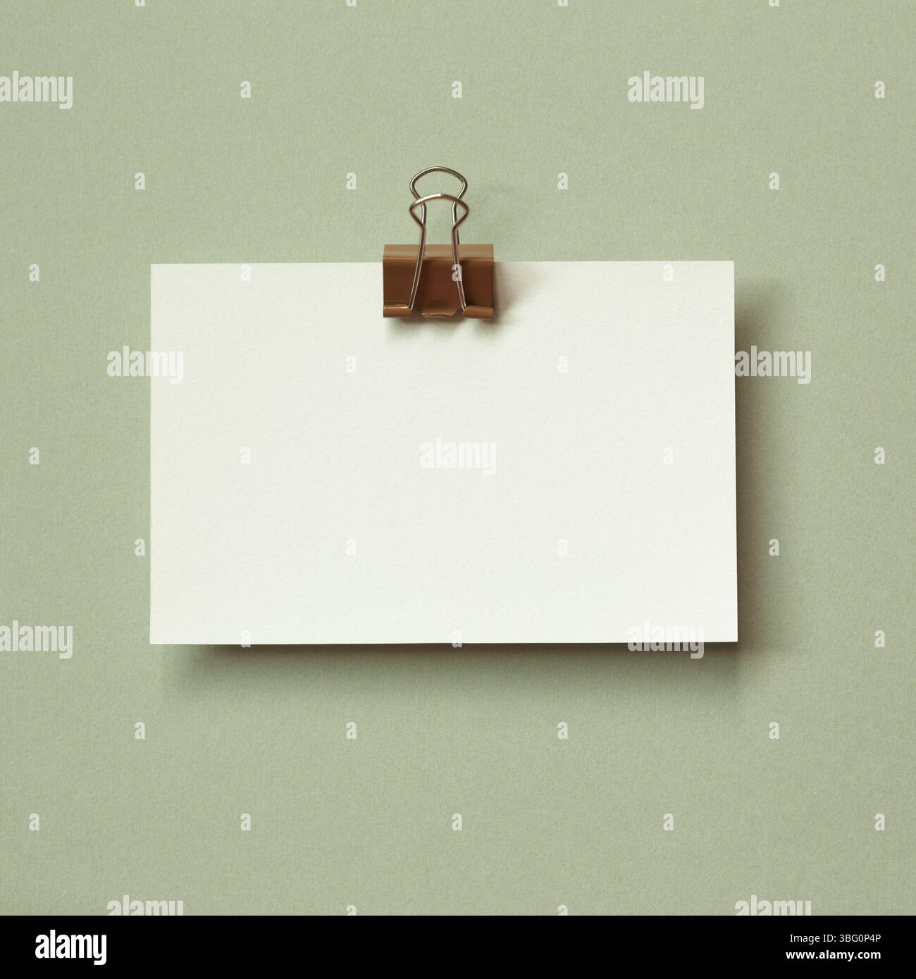 Blank memo pad on green background. copy space Stock Photo