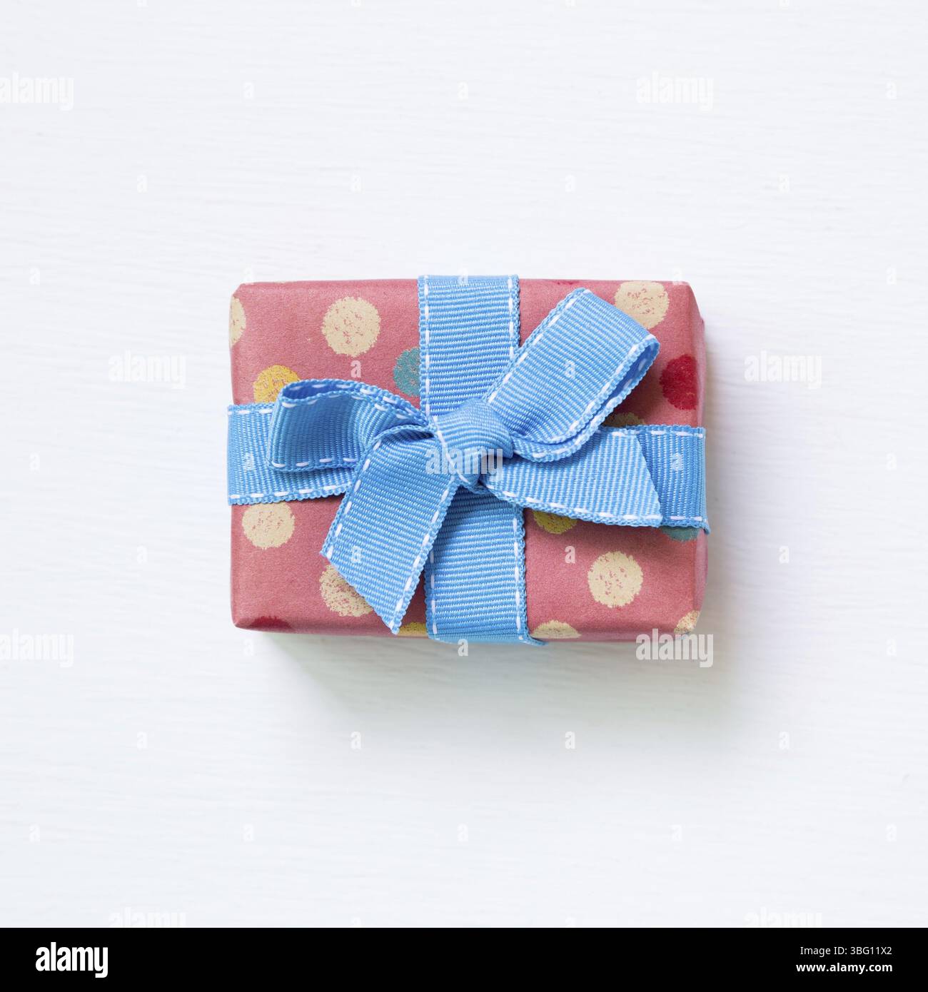 Dot pattern pink gift box isolated on white background Stock Photo