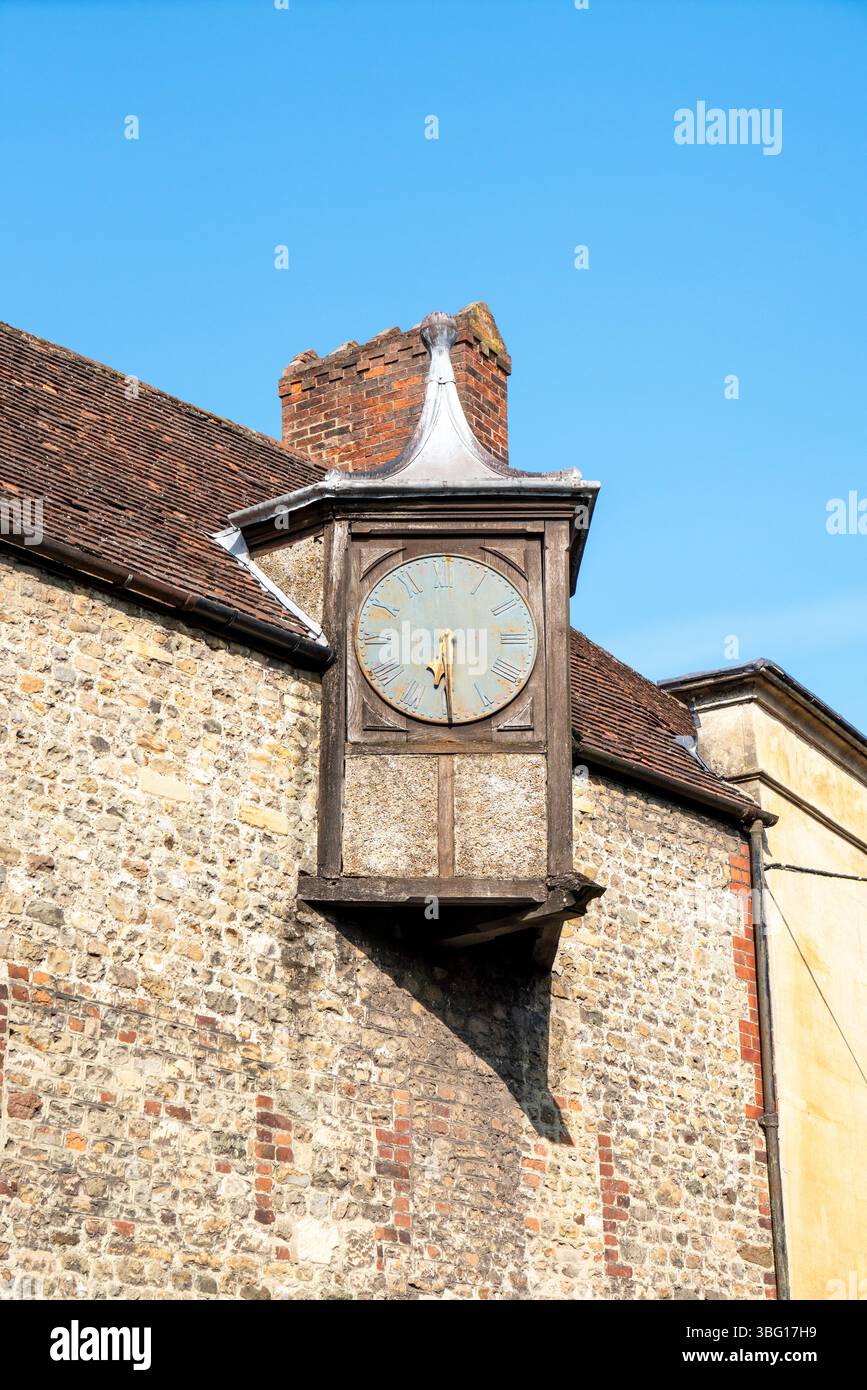 Old clock face on the side of a building Stock Photo