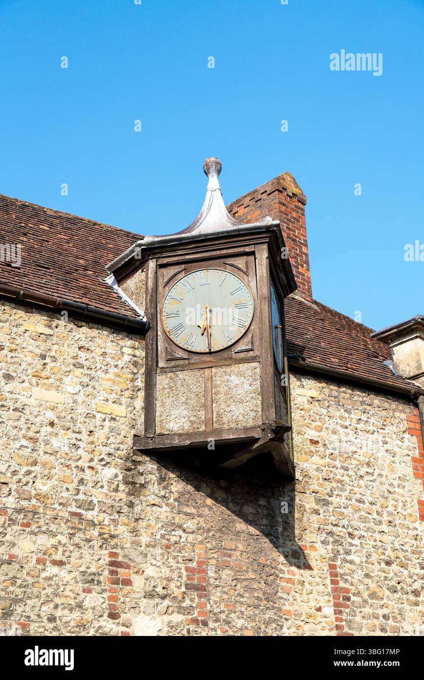Old clock face on the side of a building Stock Photo