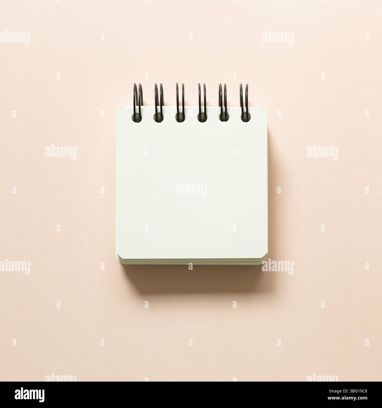 Blank notepad isolated on pink background. top view Stock Photo