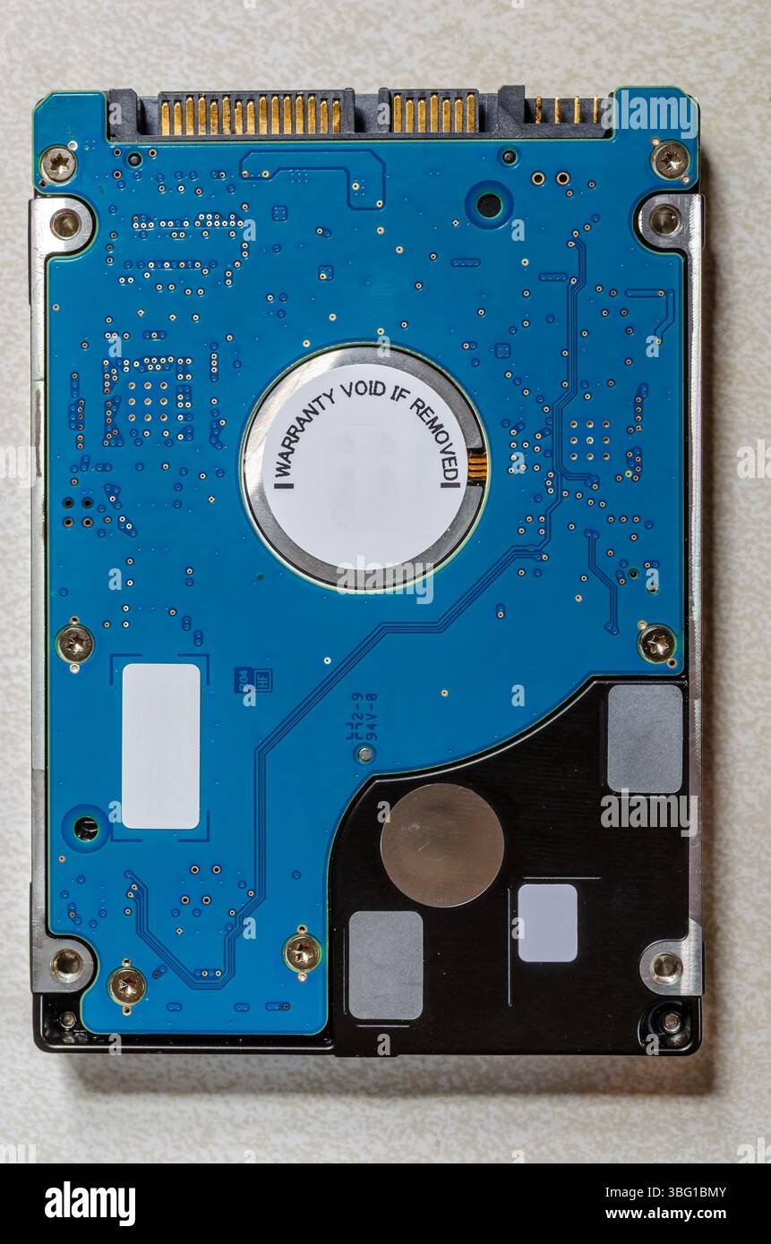 2.5 inch used generic internal hard drive,showing digital circuits Stock Photo
