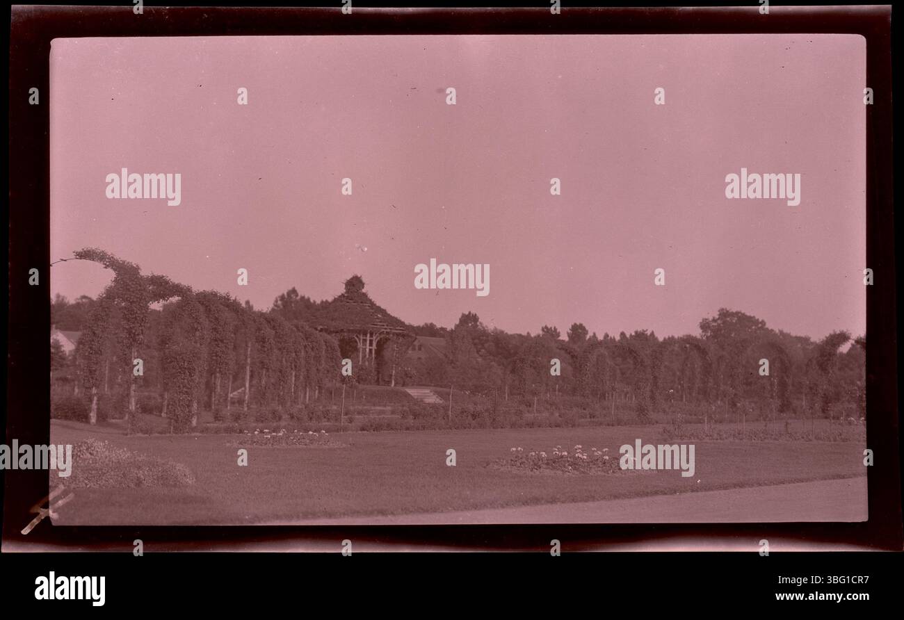 A plant-covered trellis in the rose garden of Hartford, Connecticut's Elizabeth Park Conservancy, with a gazebo at its center. The Arrases visited Hartford in 1913 on their way to Europe. Edmund F. Arras, a prominent Columbus businessman, founded one of the city's first property rental agencies. His photos from this journey document significant European locations from 1913. Stock Photo