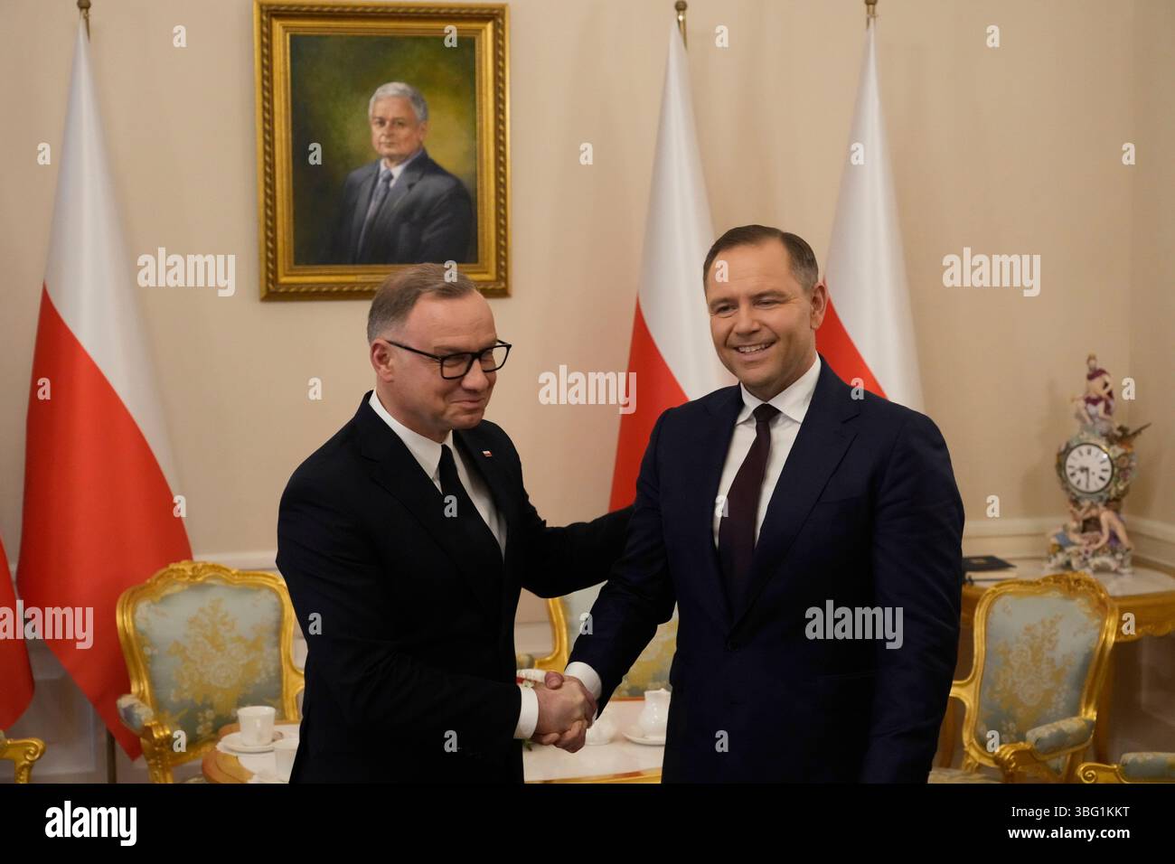 Poland's outgoing President Andrzej Duda, left, welcomes the President ...