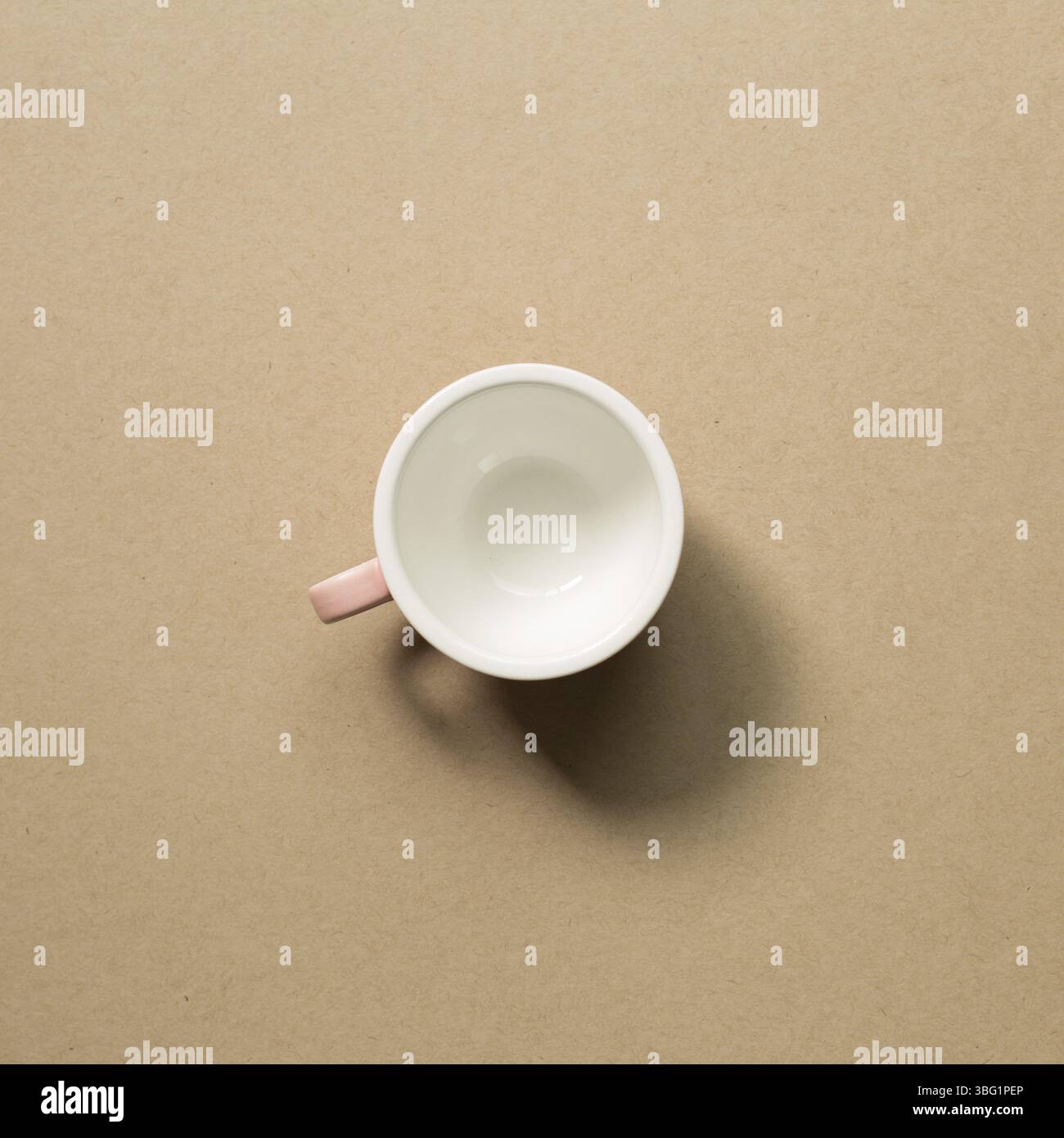 Empty mug cup on brown background Stock Photo