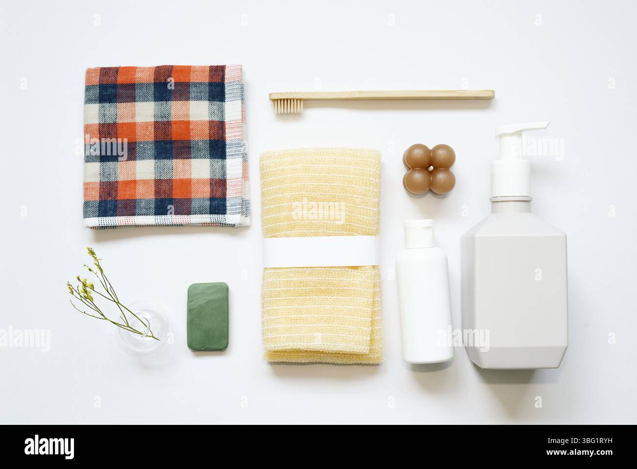 Bathroom spa products. shampoo, shower soap, towel, toothbrush on white background. flat lay, top view, copy space Stock Photo