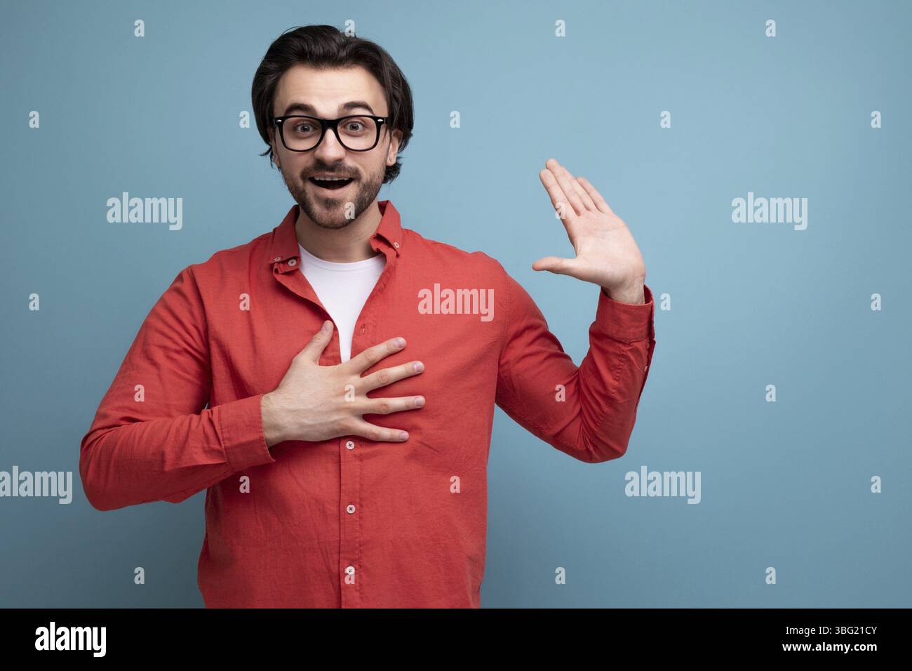 Smart handsome young brunette man with glasses explains an idea Stock Photo