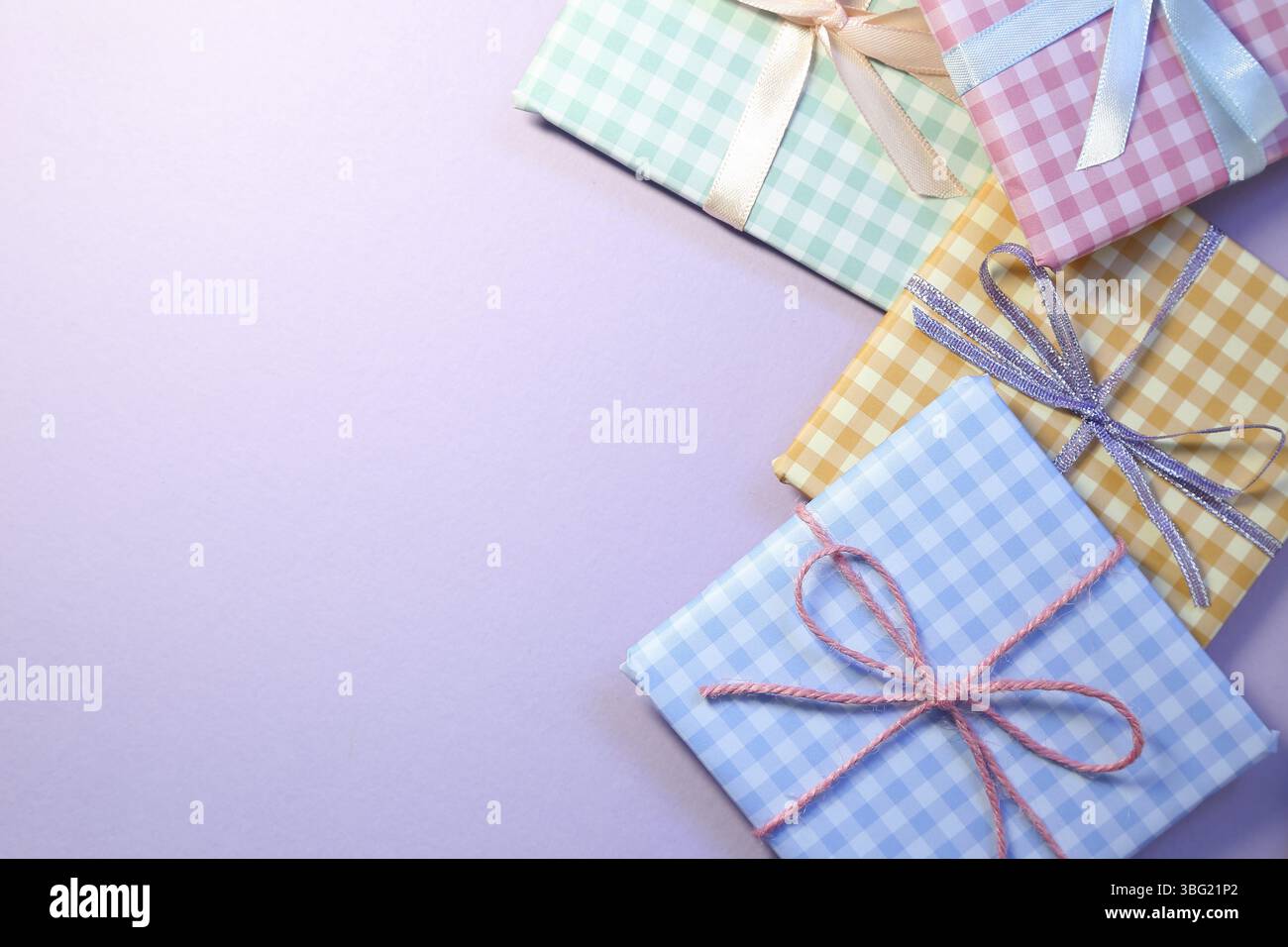 Check pattern colorful gift boxes on purple background Stock Photo
