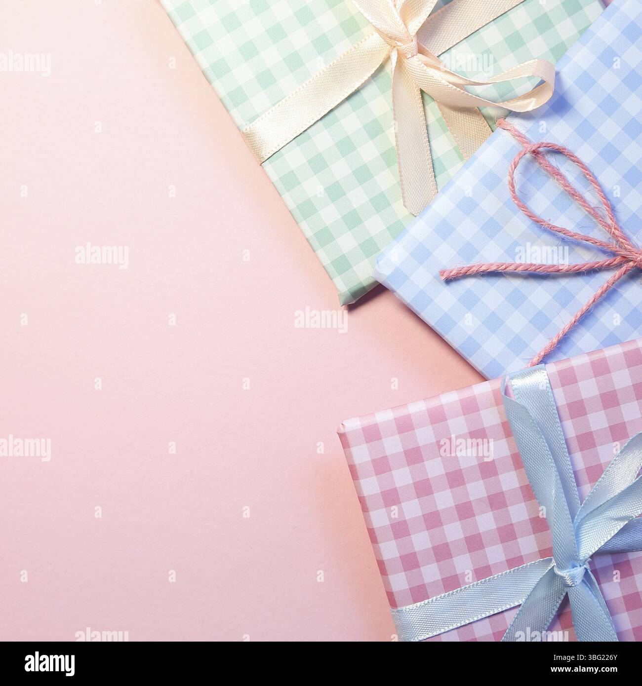 Check pattern colorful gift boxes on pink background Stock Photo