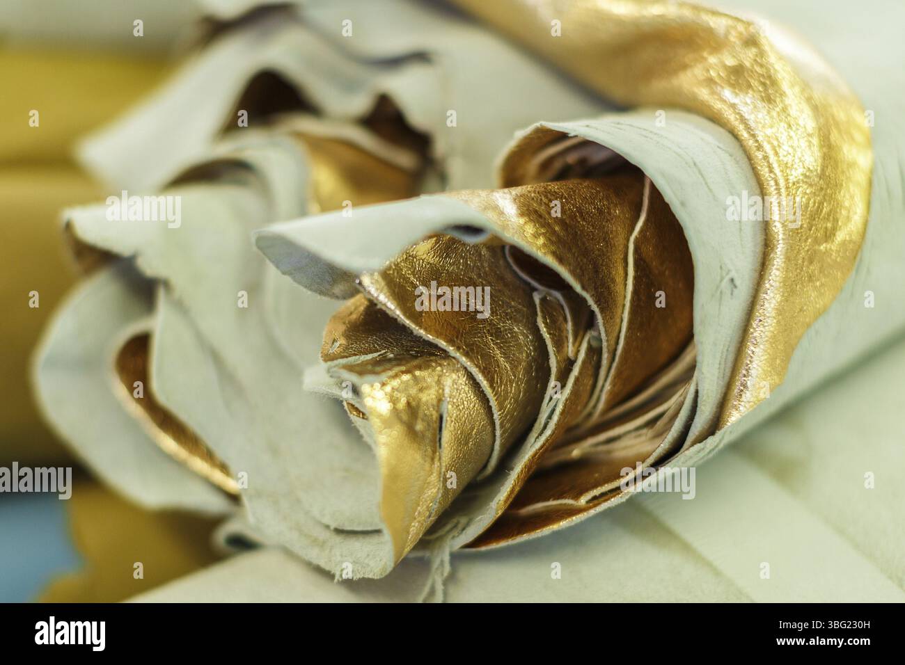 Roll gold colored material hi-res stock photography and images - Alamy