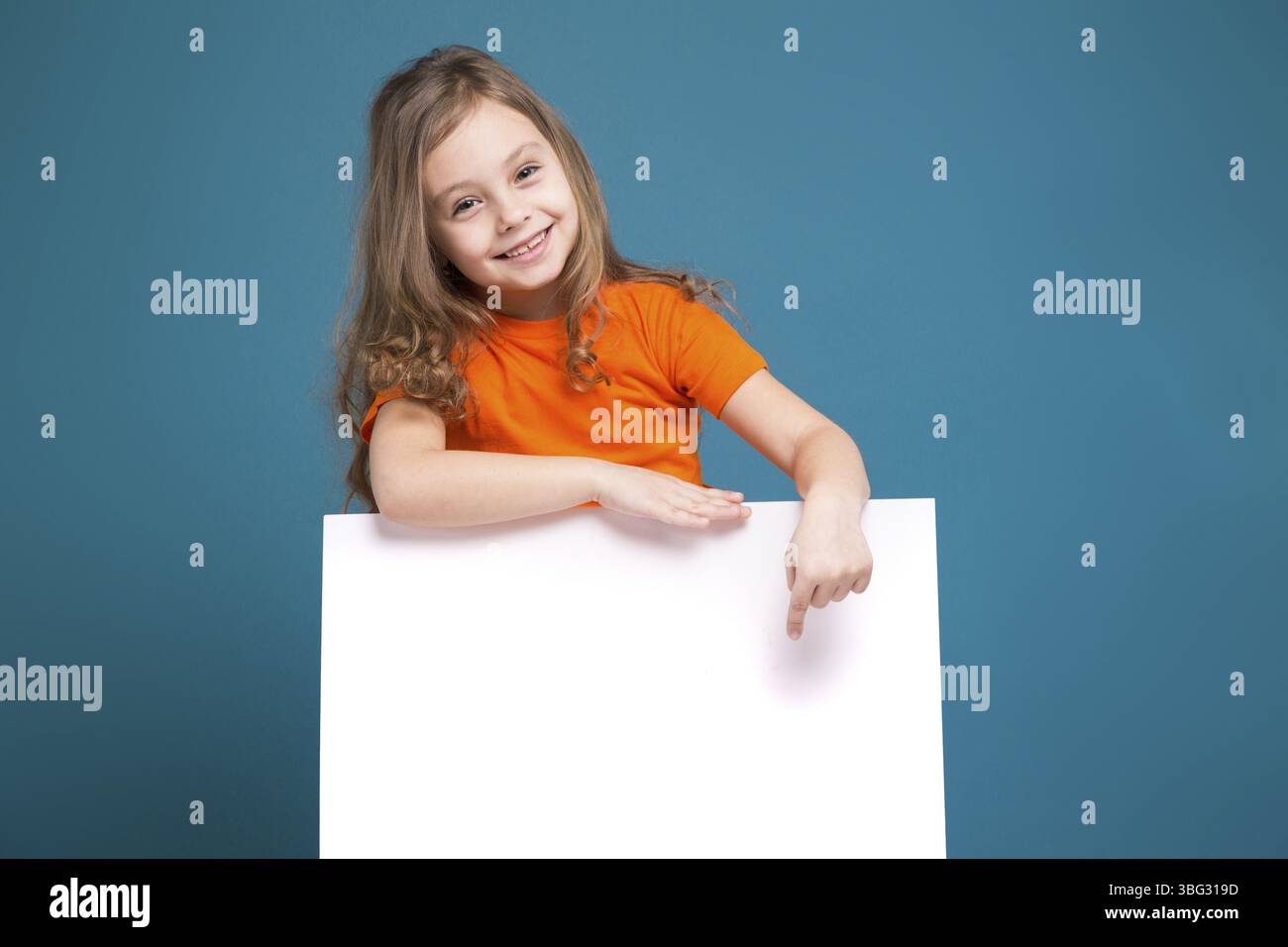 Child in orange shirt hi-res stock photography and images - Alamy
