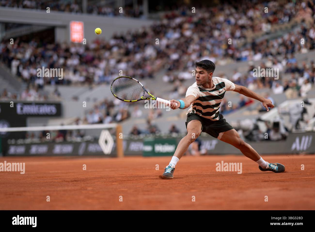 Carlos Alcaraz in action during his men's singles quarter final match