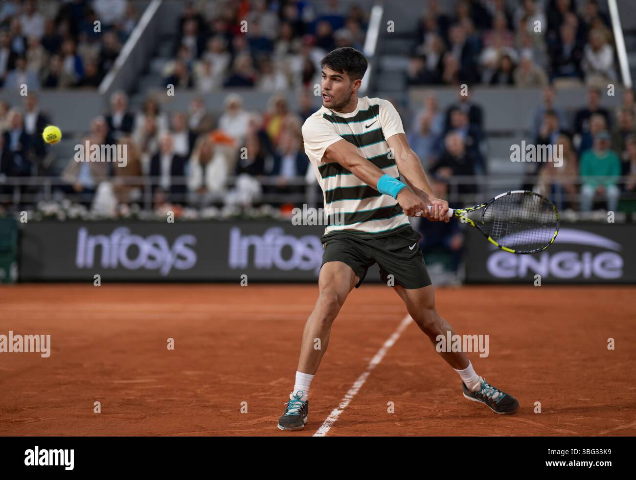 Carlos Alcaraz in action during his men's singles quarter final match