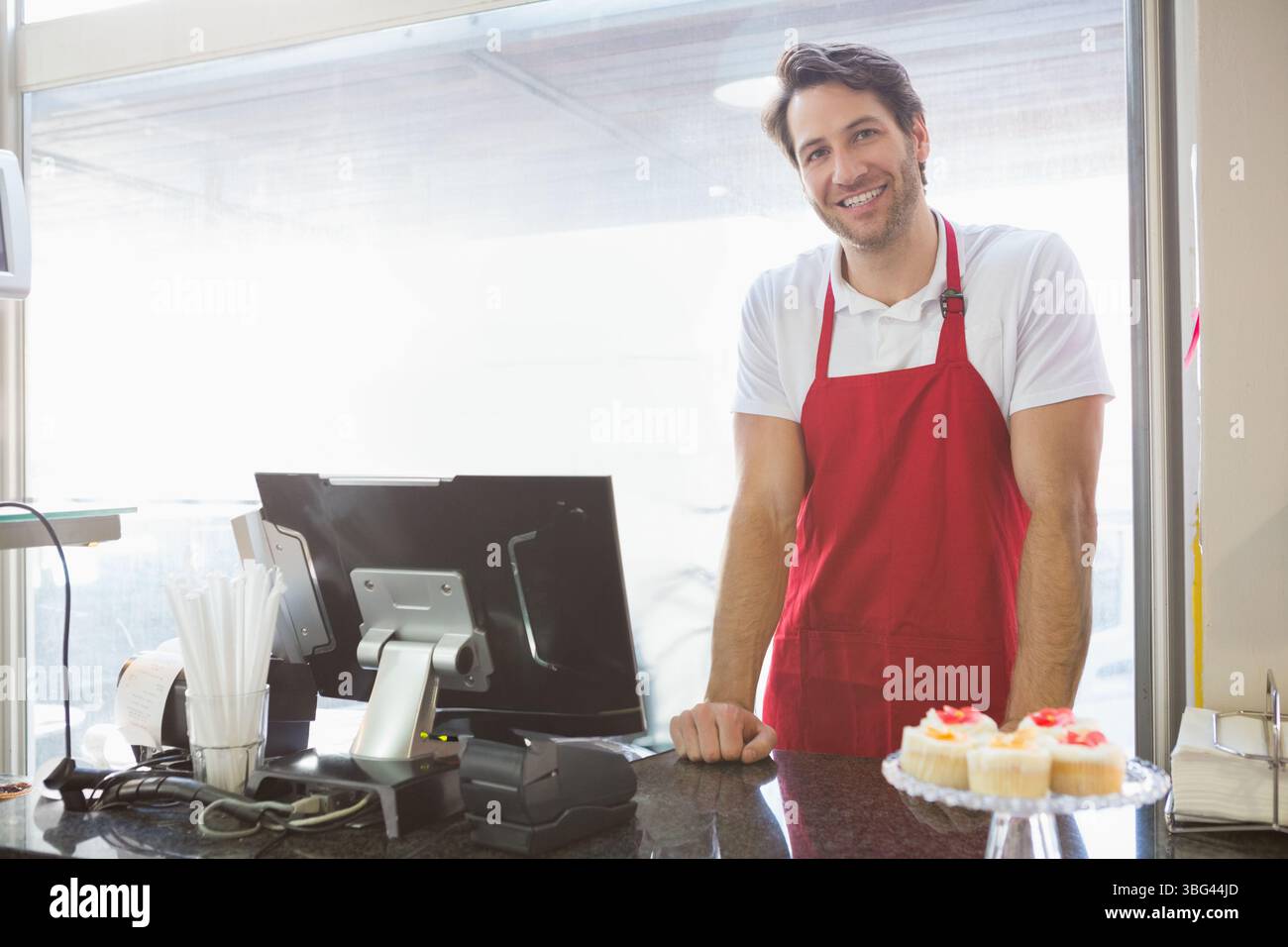 Adult barista wearing red hi-res stock photography and images - Alamy
