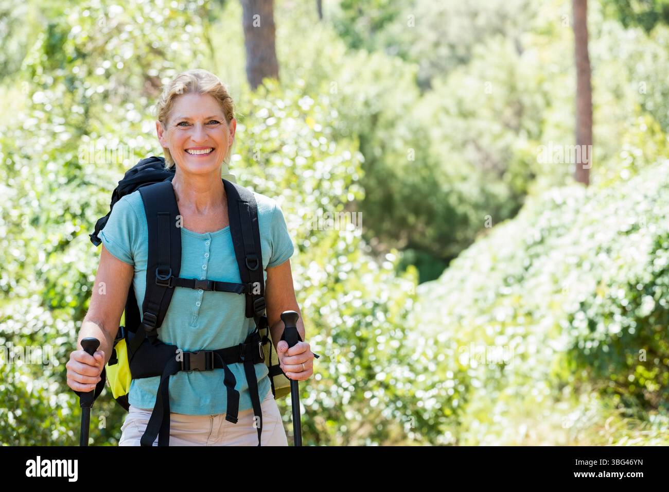 Woman gripping trekking poles hi-res stock photography and images - Alamy
