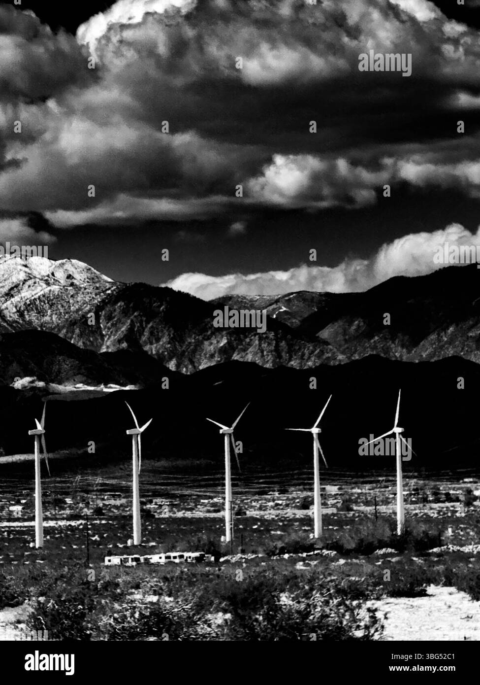 Mountain background with power turbines highlighted - Smartphone Captured Stock Image