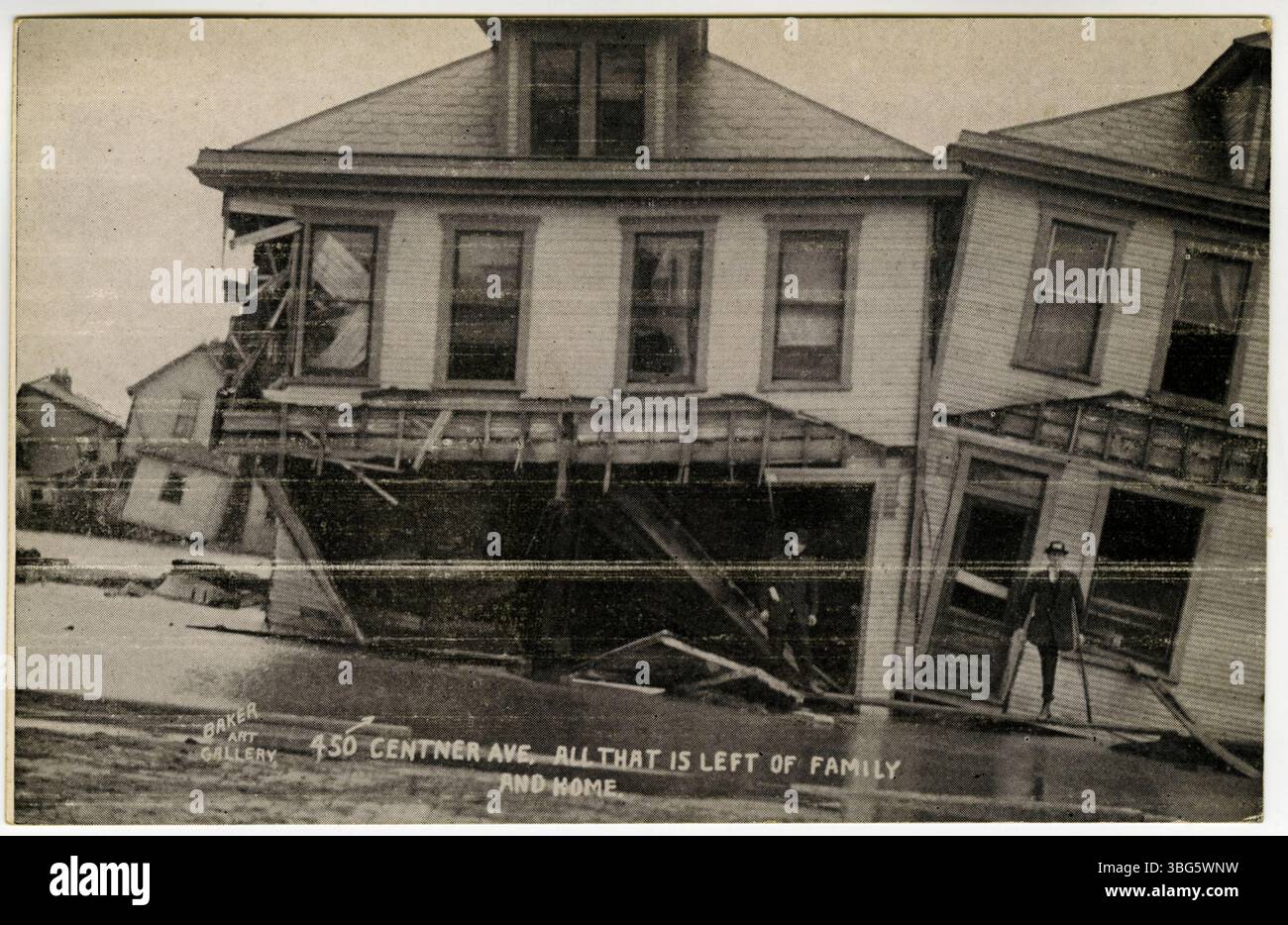 This black and white postcard shows a man standing in front of two homes on Centner Avenue, Columbus, Ohio, after the 1913 flood. The image illustrates the devastation caused by the flood, highlighting the destruction of homes and personal belongings. Stock Photo