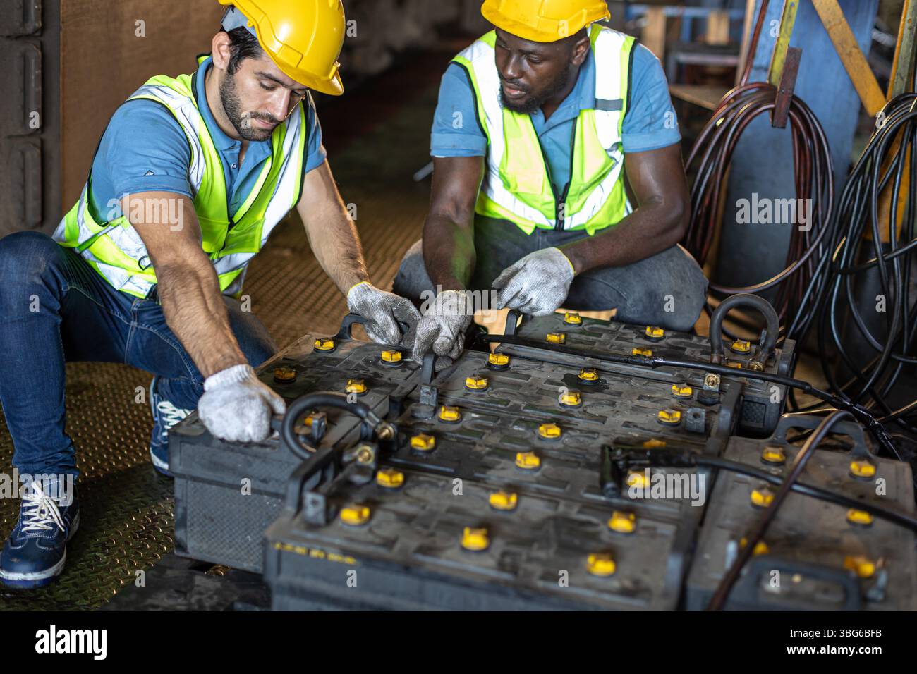 Engineer male workers working charging old battery, Train power supply ...