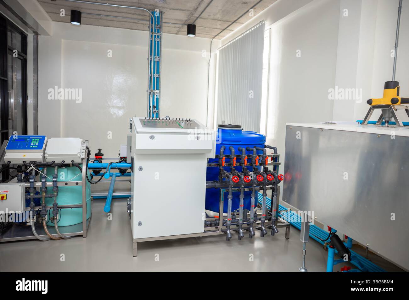 Smart farm chemical fertilizer mixing room, Water PH correction control system, automatic electronic pump sprinklers operate control panel. Stock Photo