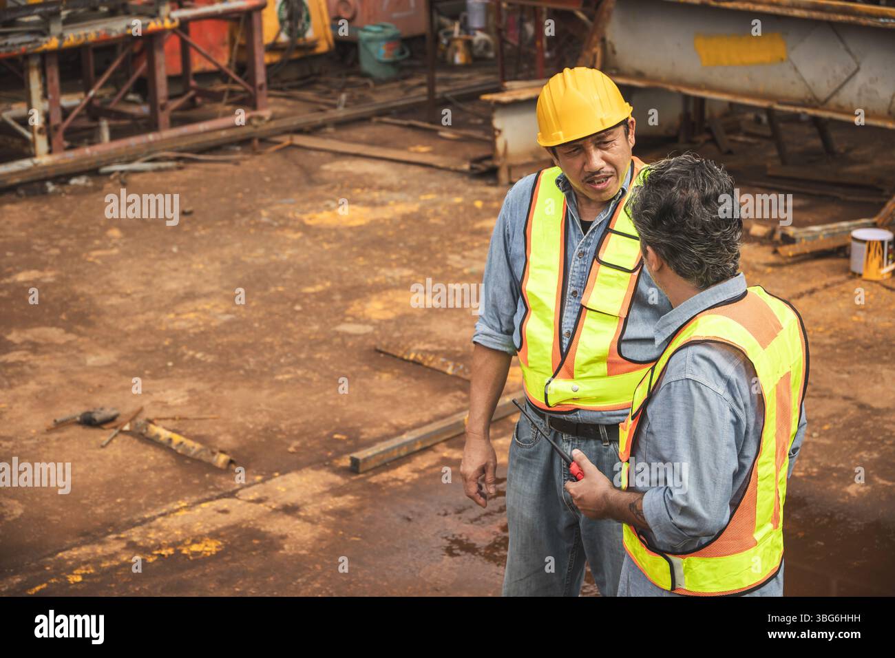 Construction engineer team working together join teamwork talking together at construction site Stock Photo