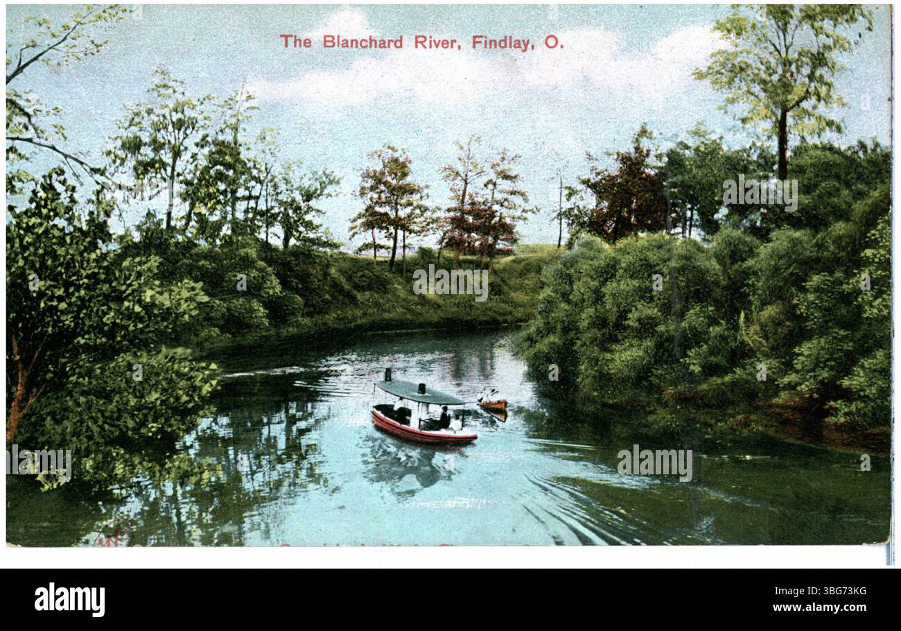 A black and white photograph of the Blanchard River in Findlay, Ohio, showing a steam launch and a small boat floating on the river. Stock Photo