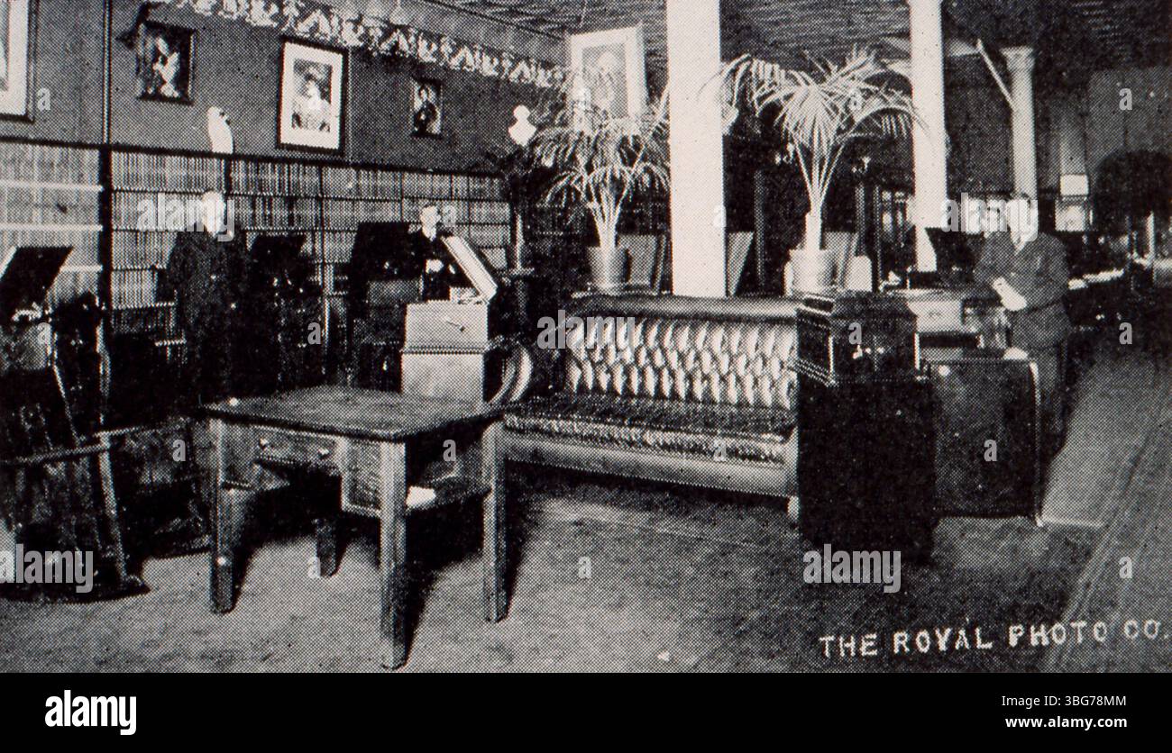 This 1915 photograph shows the interior of Perry B. Whitsit Company, which sold Victor and Edison phonographs, as well as pianos. Founded in 1909, the business specialized in sound recording and playback machines. Stock Photo
