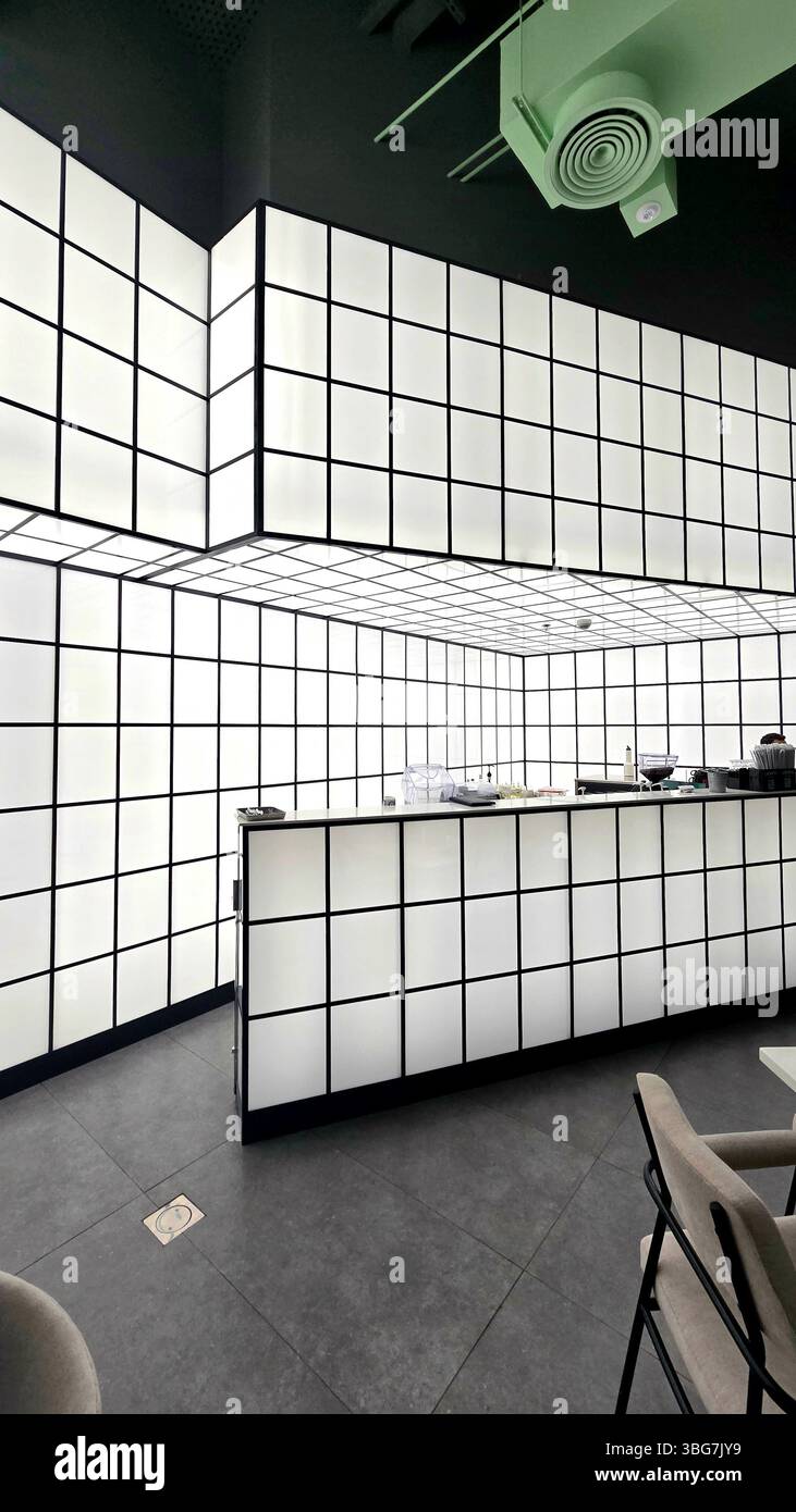 An interior view of Urbano Bistro, a dining establishment situated in Muscat, Oman, captured on December 21, 2024. The image documents the restaurant. - Smartphone Captured Stock Image