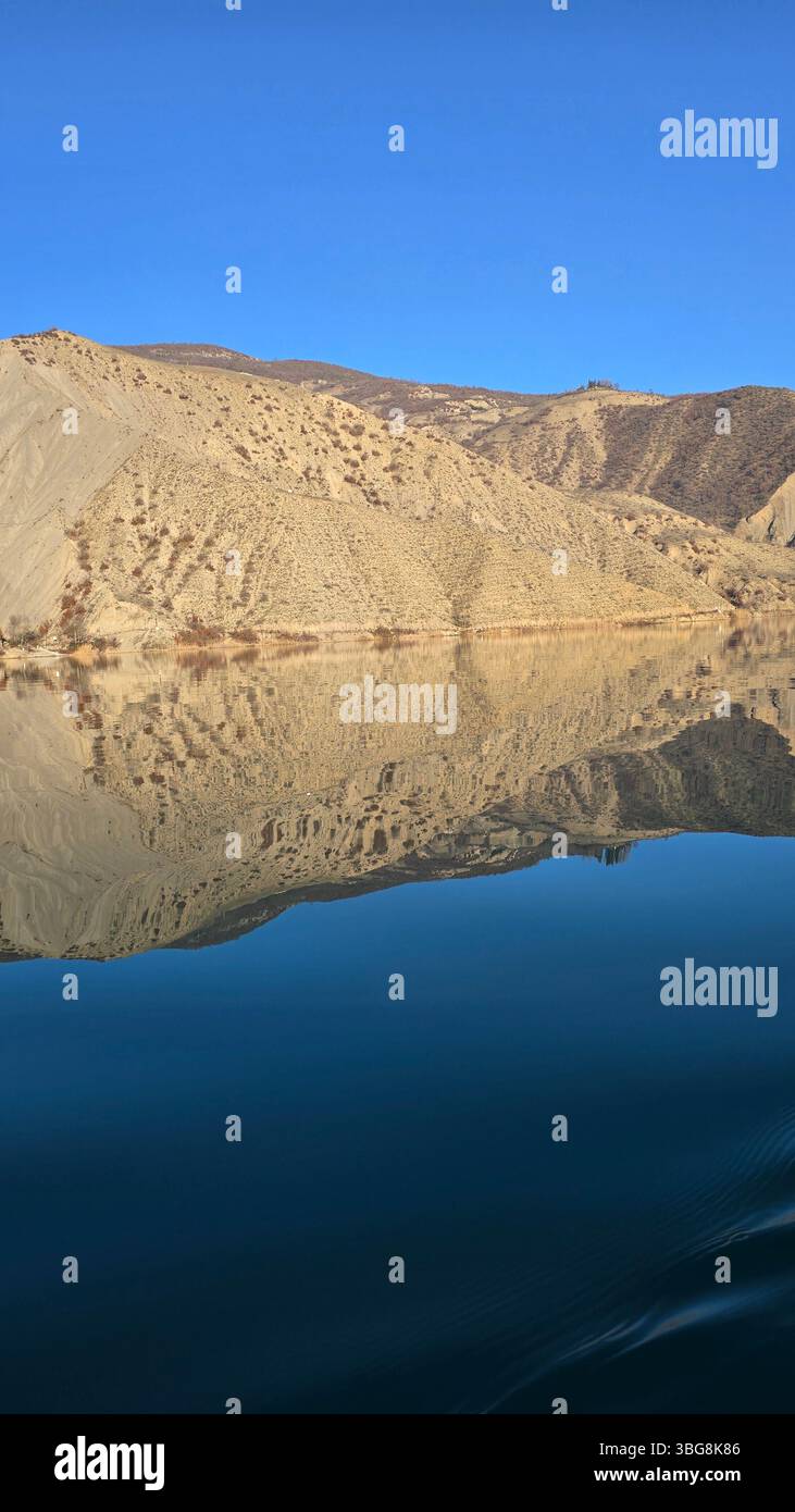 The pristine waters of Valasht Lake nestled amidst the majestic Alborz Mountains in Mazandaran Province, Iran - Smartphone Captured Stock Image