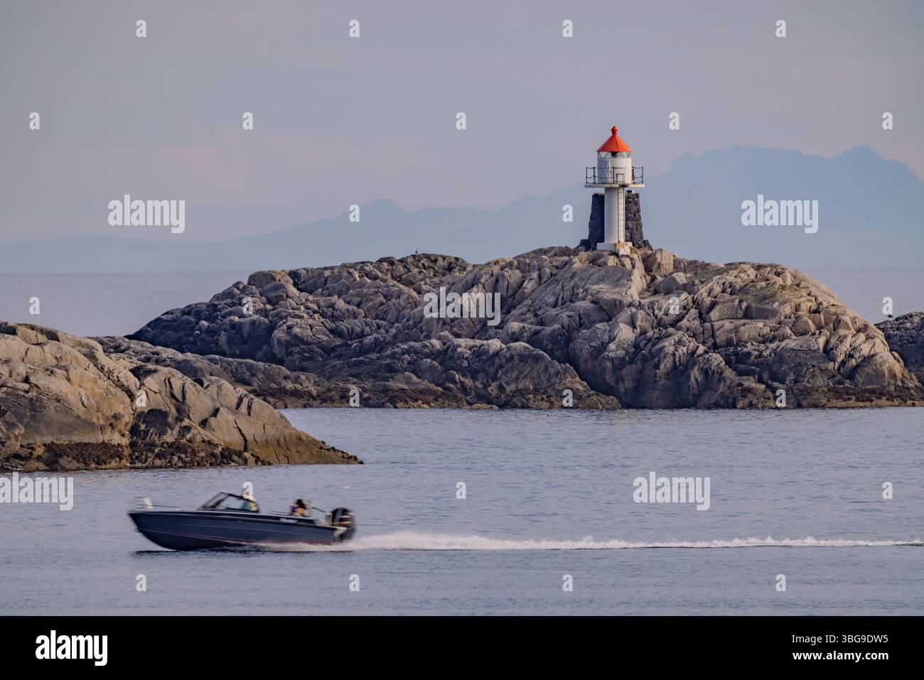 a-small-powerboat-speeds-past-a-coastal-lighthouse-perched-on-rocky