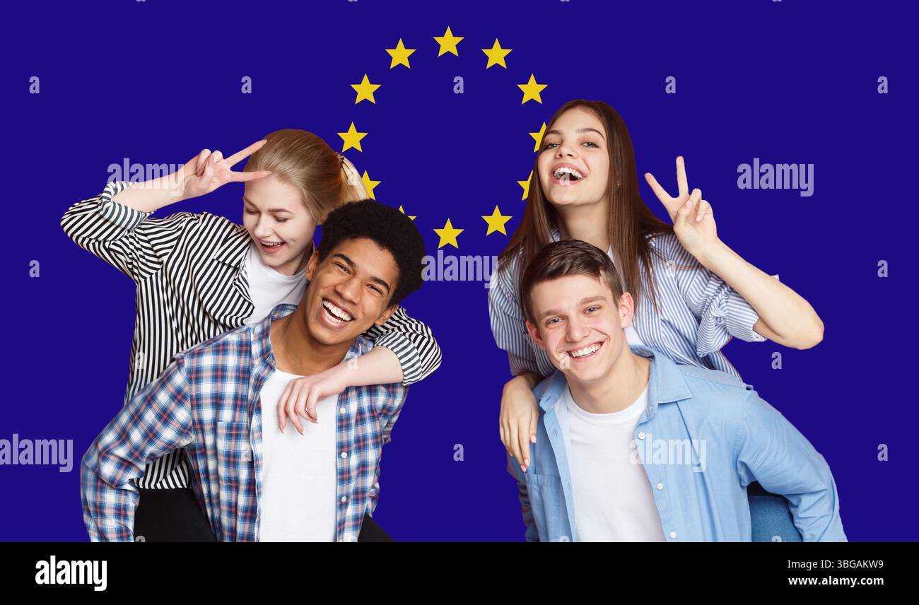Group Of Happy Multi Ethnic Students Standing In Front Of EU Flag Stock Photo