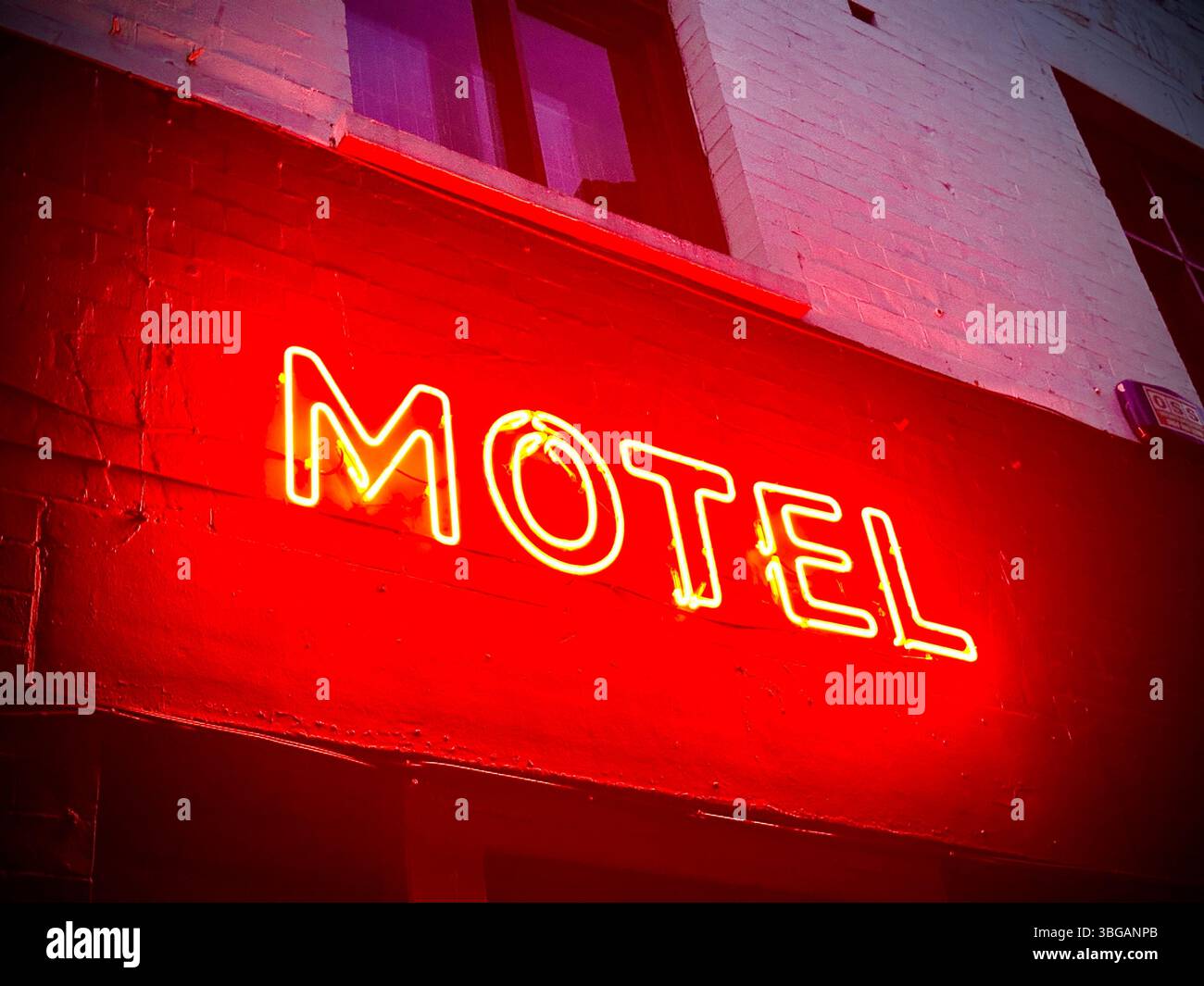 Close-up of glowing red neon MOTEL sign on brick building in Liverpool, 17 May 2025 - Smartphone Captured Stock Image Close-up of glowing red neon MOTEL sign on brick building in Liverpool, 17 May 2025 - Smartphone Captured Stock Image