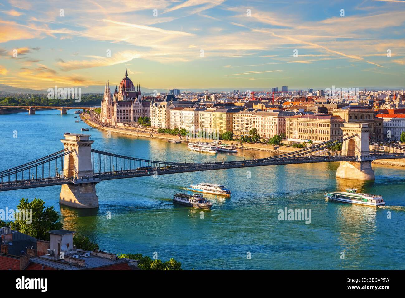 Famous Szechenyi Chain Bridge, symbol of Budapest, Hungary, summer sunset view. Stock Photo