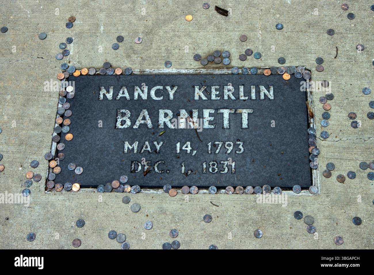 Grave in the Middle of the Road in Franklin, Indiana. Nancy Barnett and six others are buried there. Stock Photo