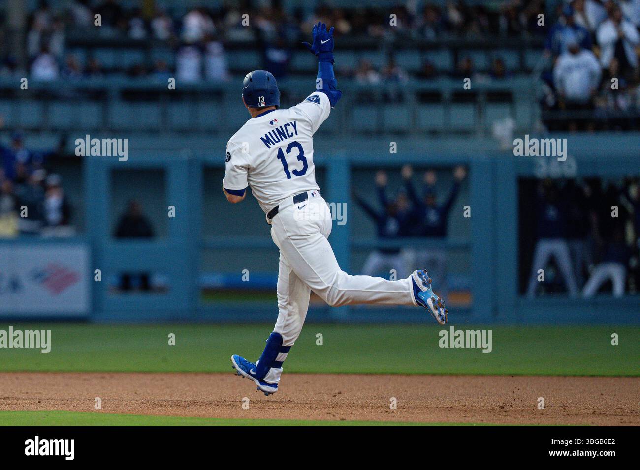Los Angeles Dodgers third base Max Muncy (13) rounds the bases after ...