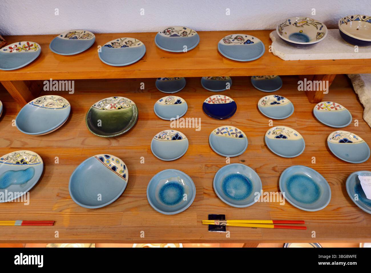 Tsuboya Beautiful pottery plates displayed at a shop on Tsuboya Yachimun Street ...