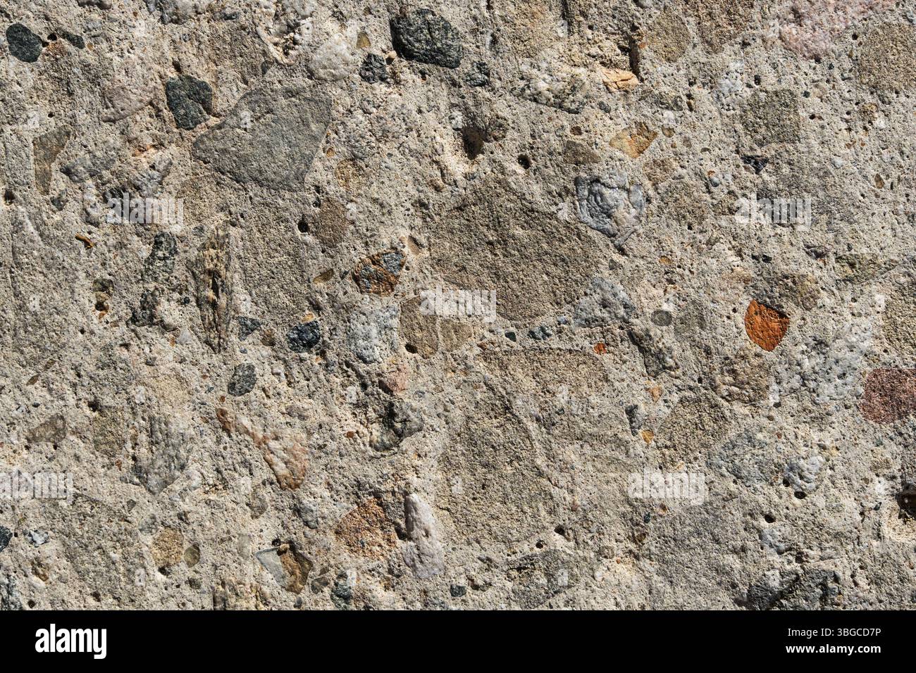 stream eroded concrete with exposed aggregate close up background texture Stock Photo