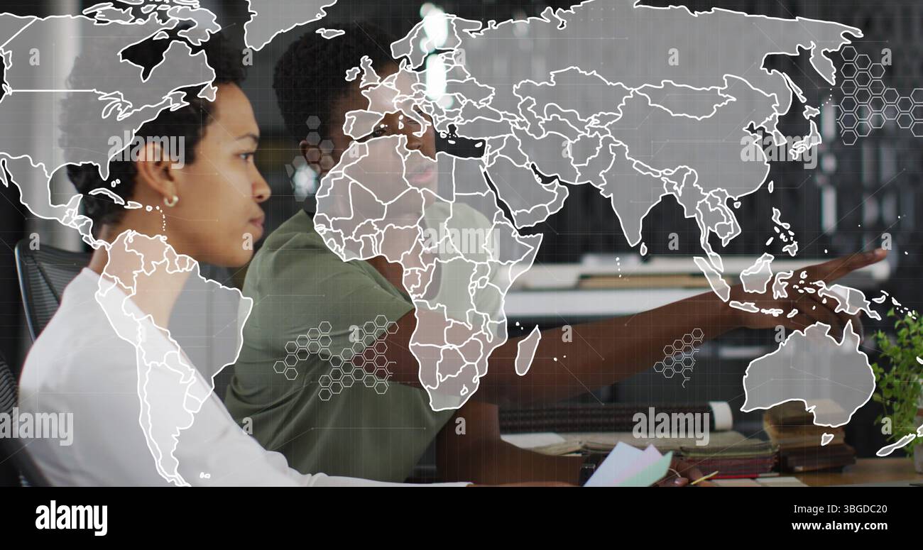 Image of world map over diverse business people in office Stock Photo