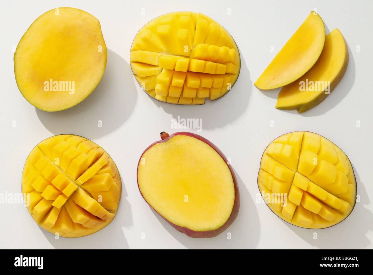Ripe sliced mango on a white background Stock Photo