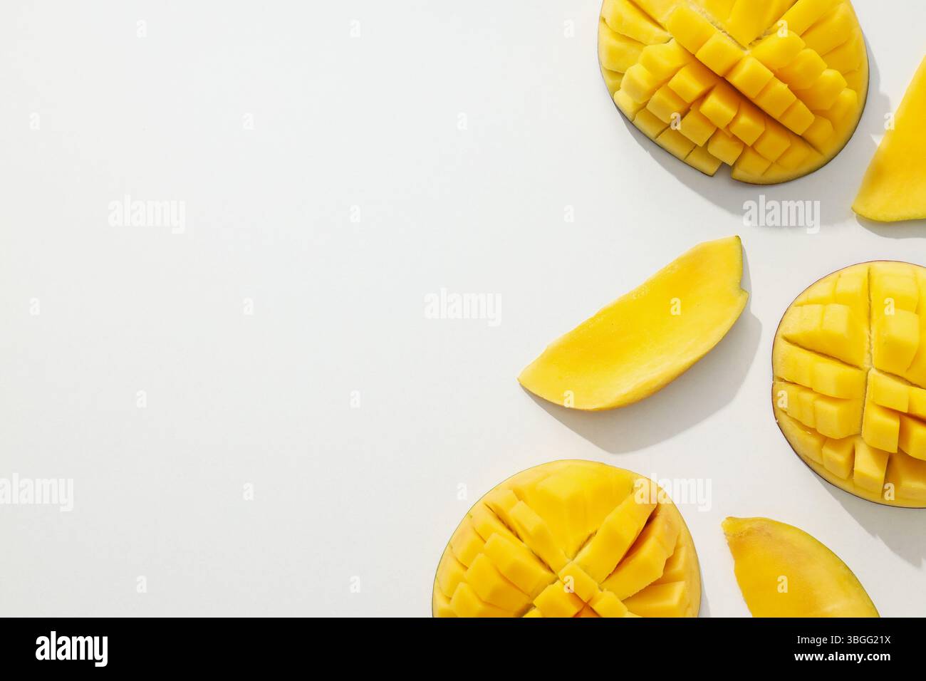 Ripe sliced mango on a white background Stock Photo