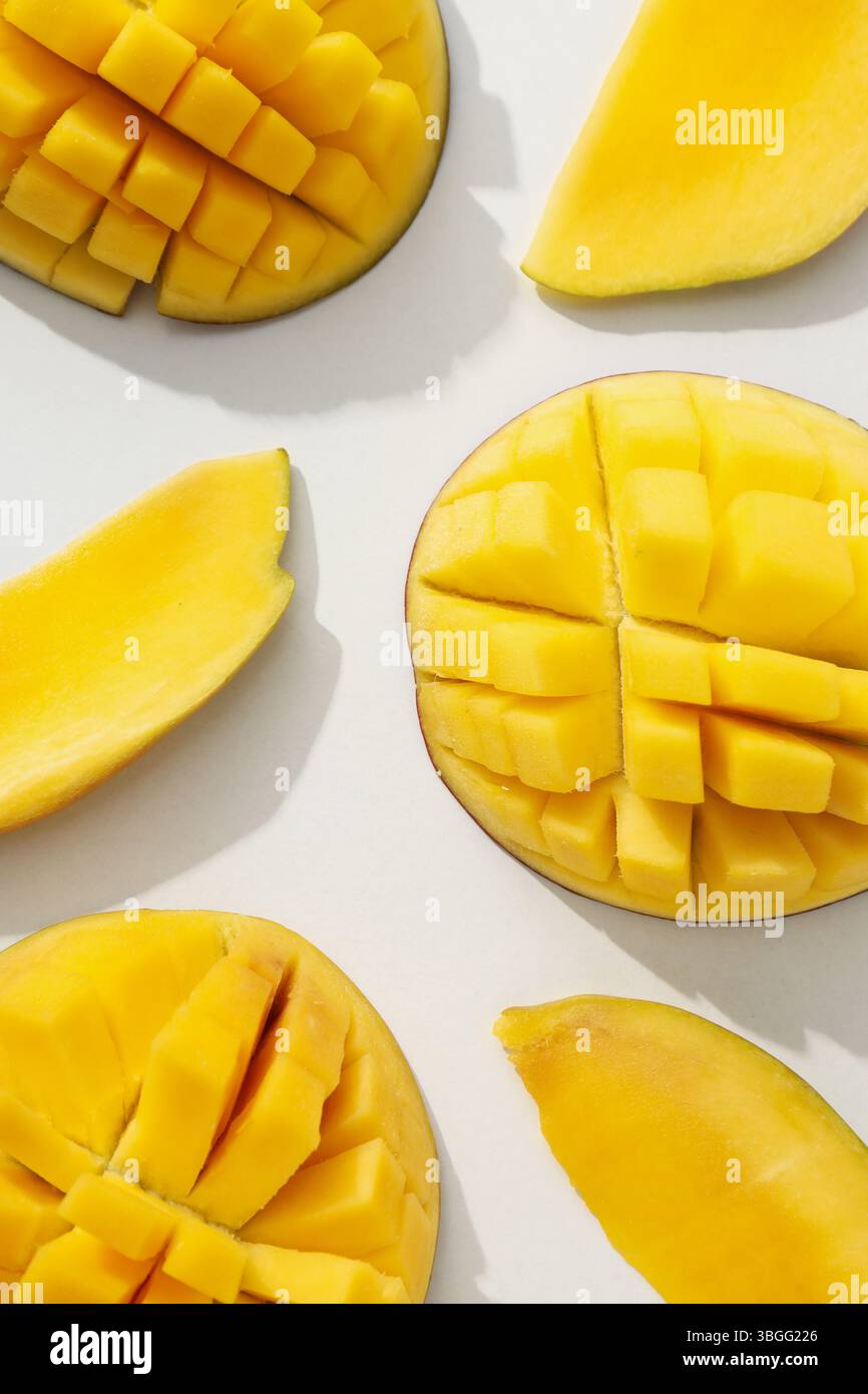 Ripe sliced mango on a white background Stock Photo