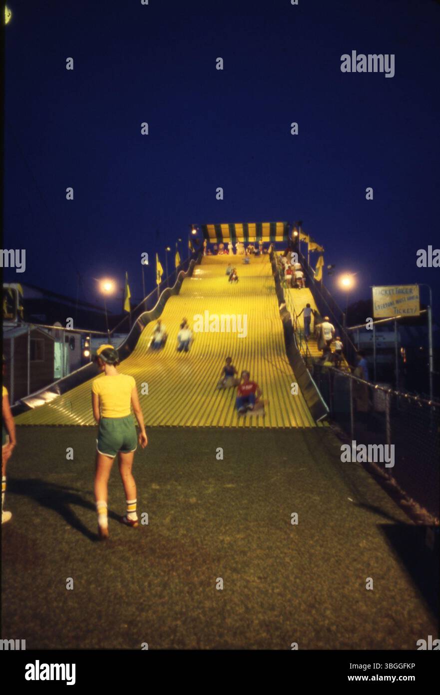The Giant Slide at the Ohio State Fair, pictured at night, is a three ...