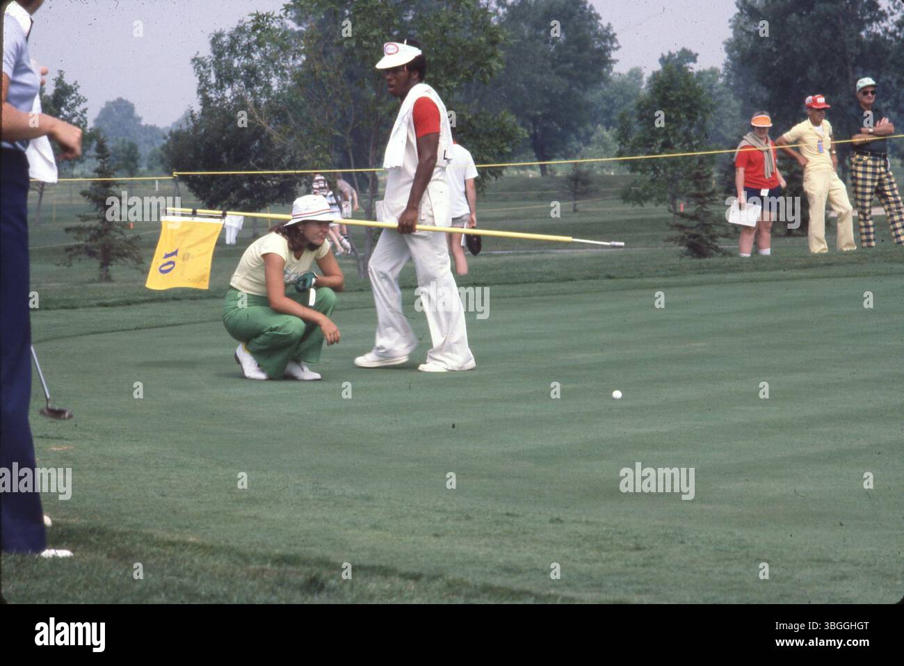 An unidentified professional female golfer looks over her approaching ...