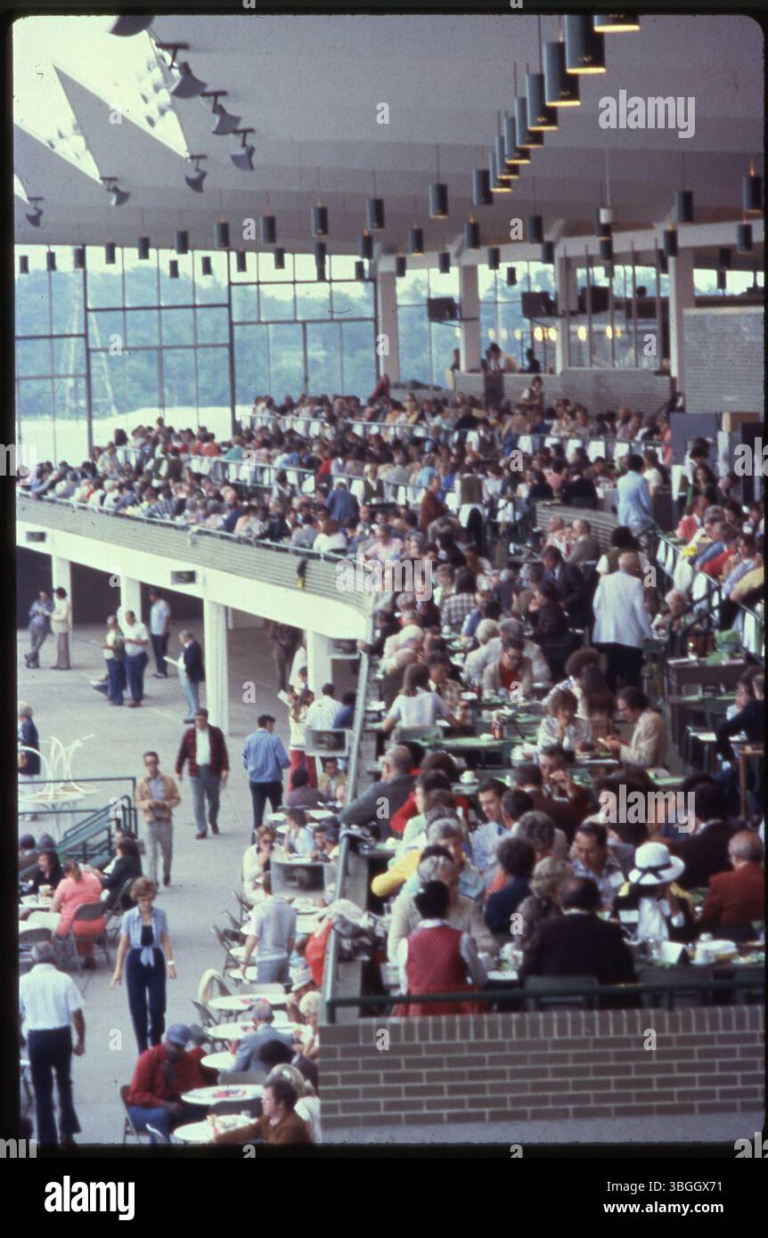 This 1980 image captures a crowded dining area at Scioto Downs racetrack. Opened on October 9, 1959, for live harness horse racing, Scioto Downs became Scioto Downs Racino in 2012 and was renamed Eldorado Scioto Downs in 2015. Stock Photo