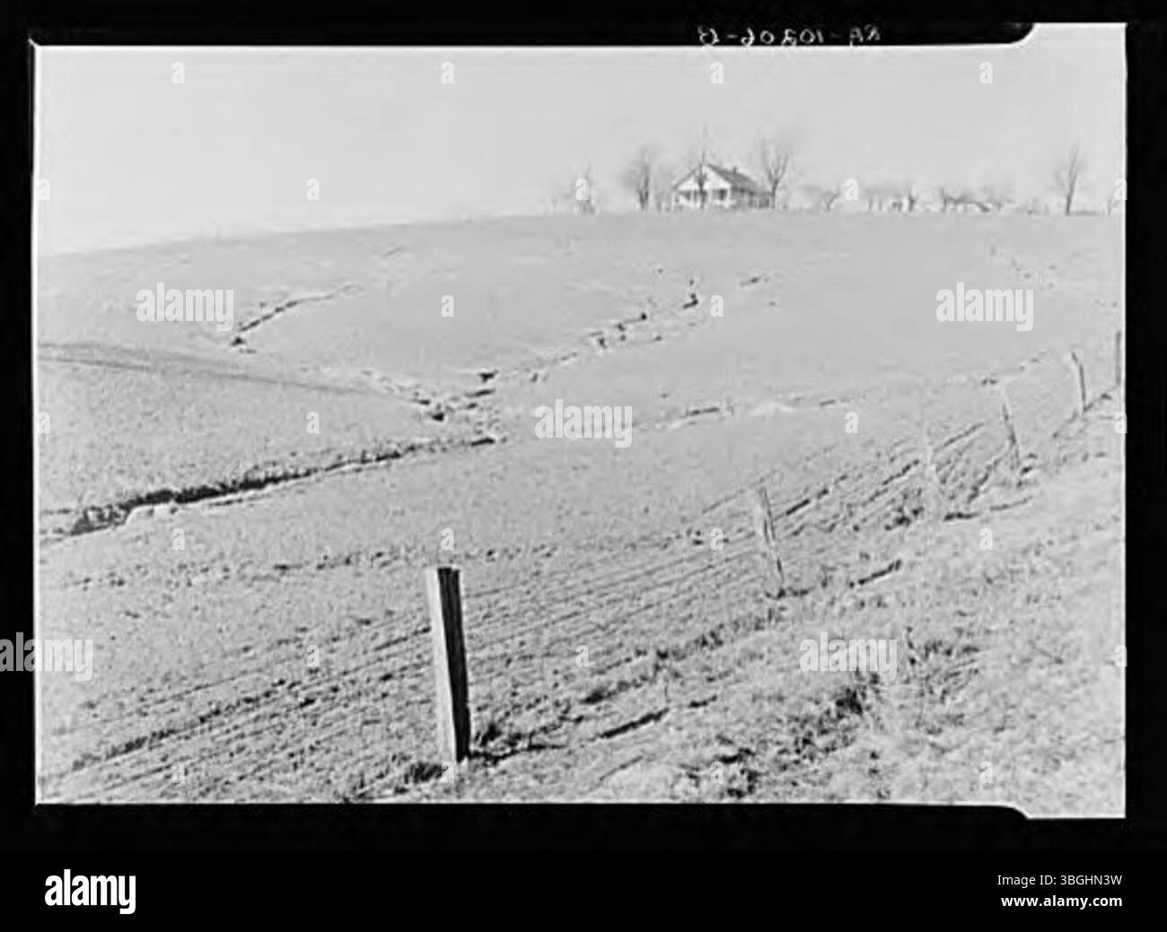 Soil erosion refers to the process by which the topsoil is worn away, often by wind, water, or human activity. This phenomenon can degrade agricultural land and affect local ecosystems. It is a significant environmental concern, particularly in areas with poor land management practices. Stock Photo