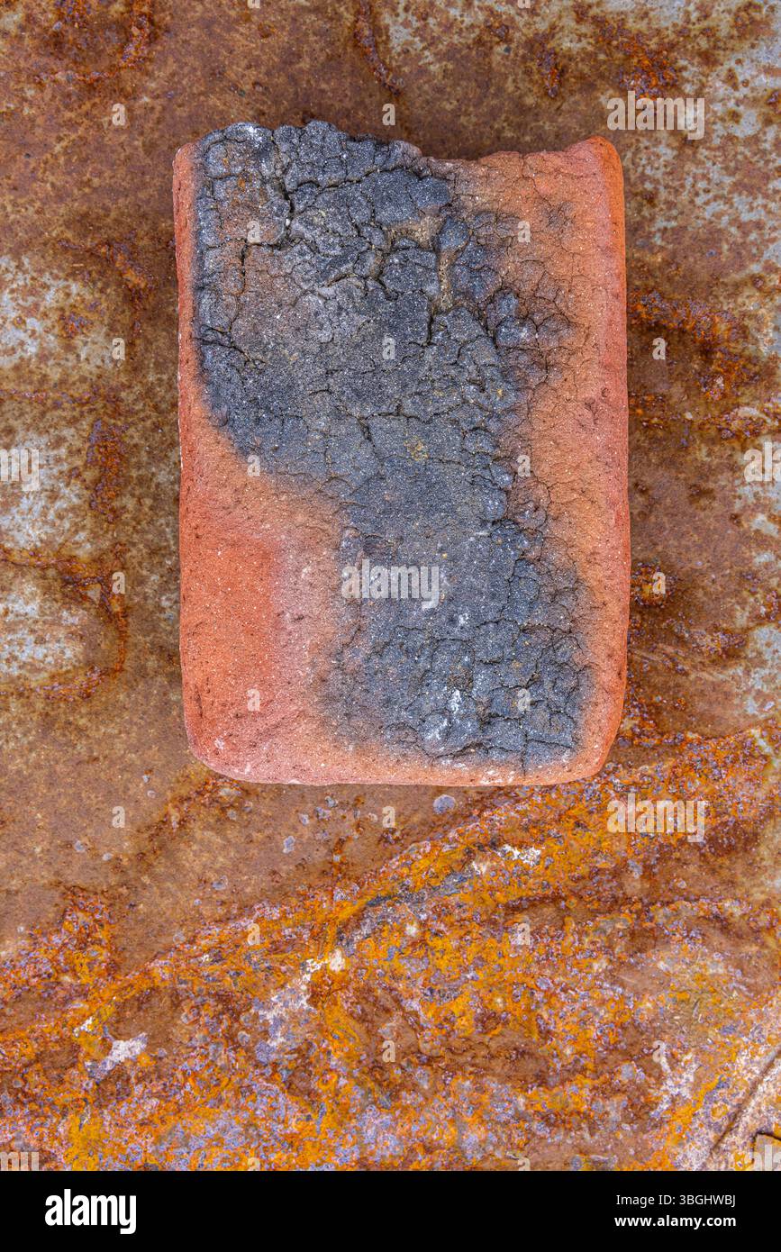 Stone on a rusty background, still life Stock Photo