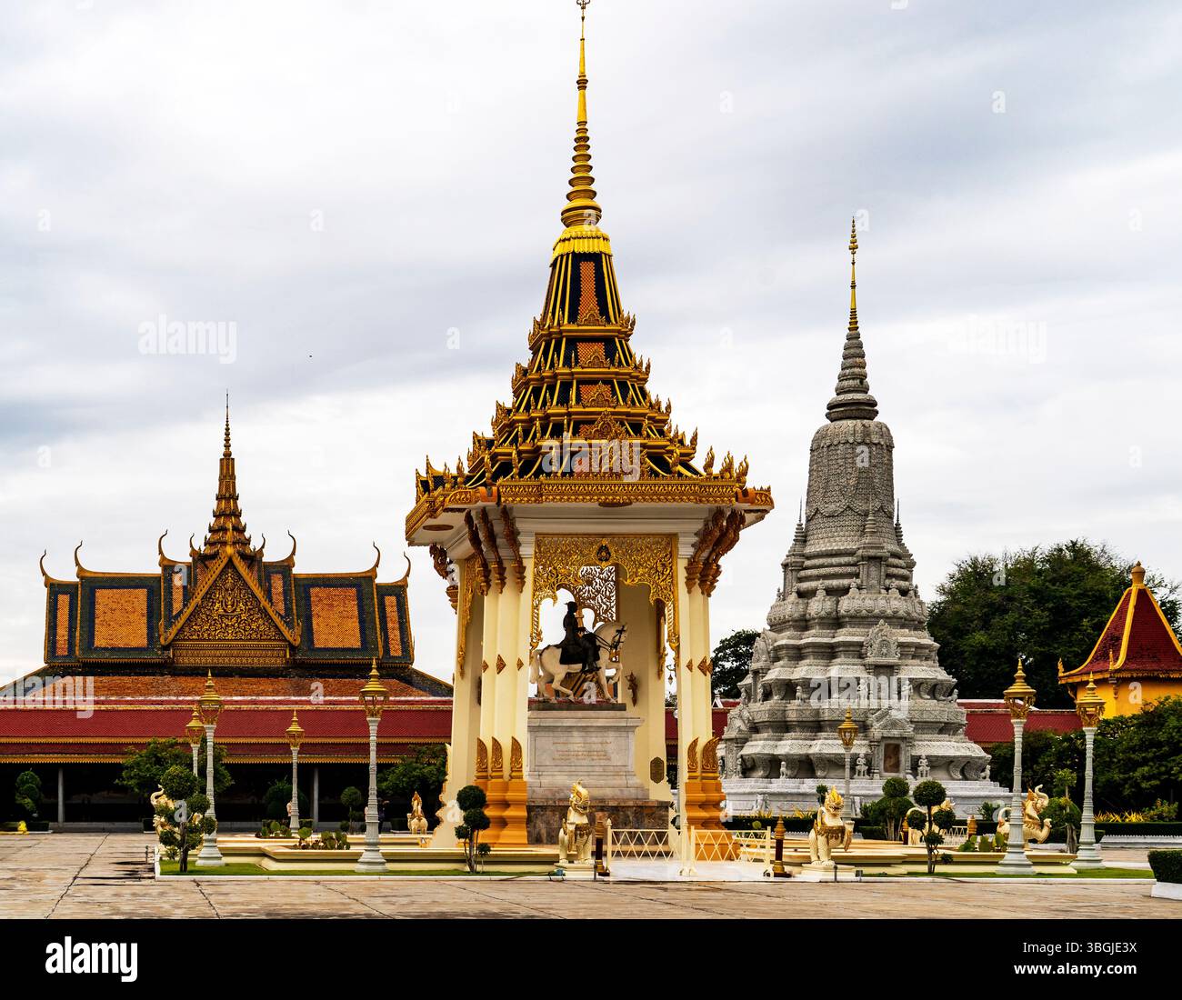 A beautiful view of a traditional Thai temple complex featuring intricate architecture, golden spires, and ornate decorations. The scene includes a ce Stock Photo