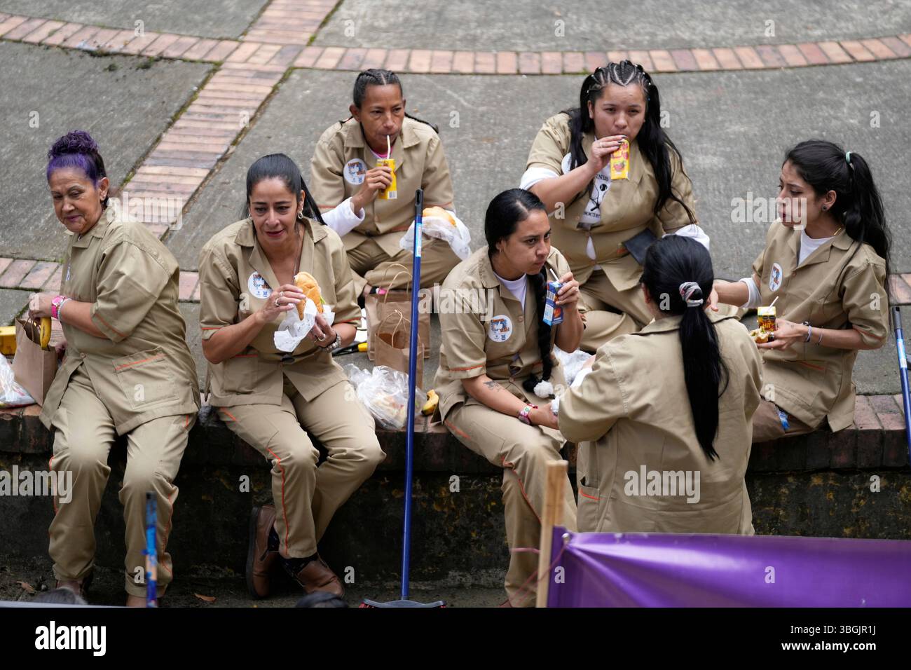 Clean Break Prison Program Inmates take a break from cleaning a park to eat breakfast as they ...