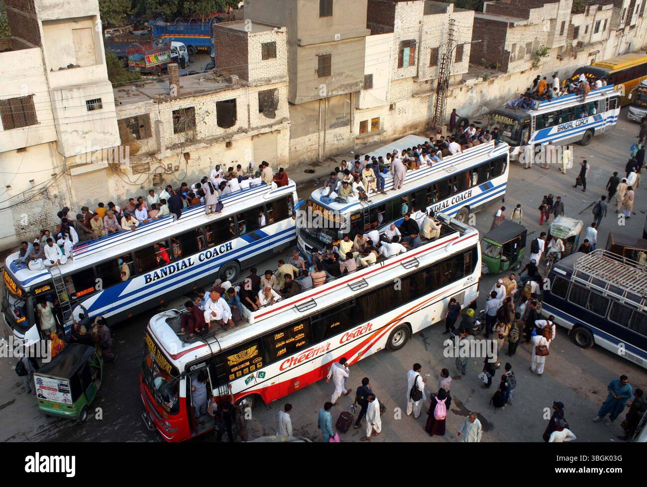 People to board on bus as they are going to their native areas to ...