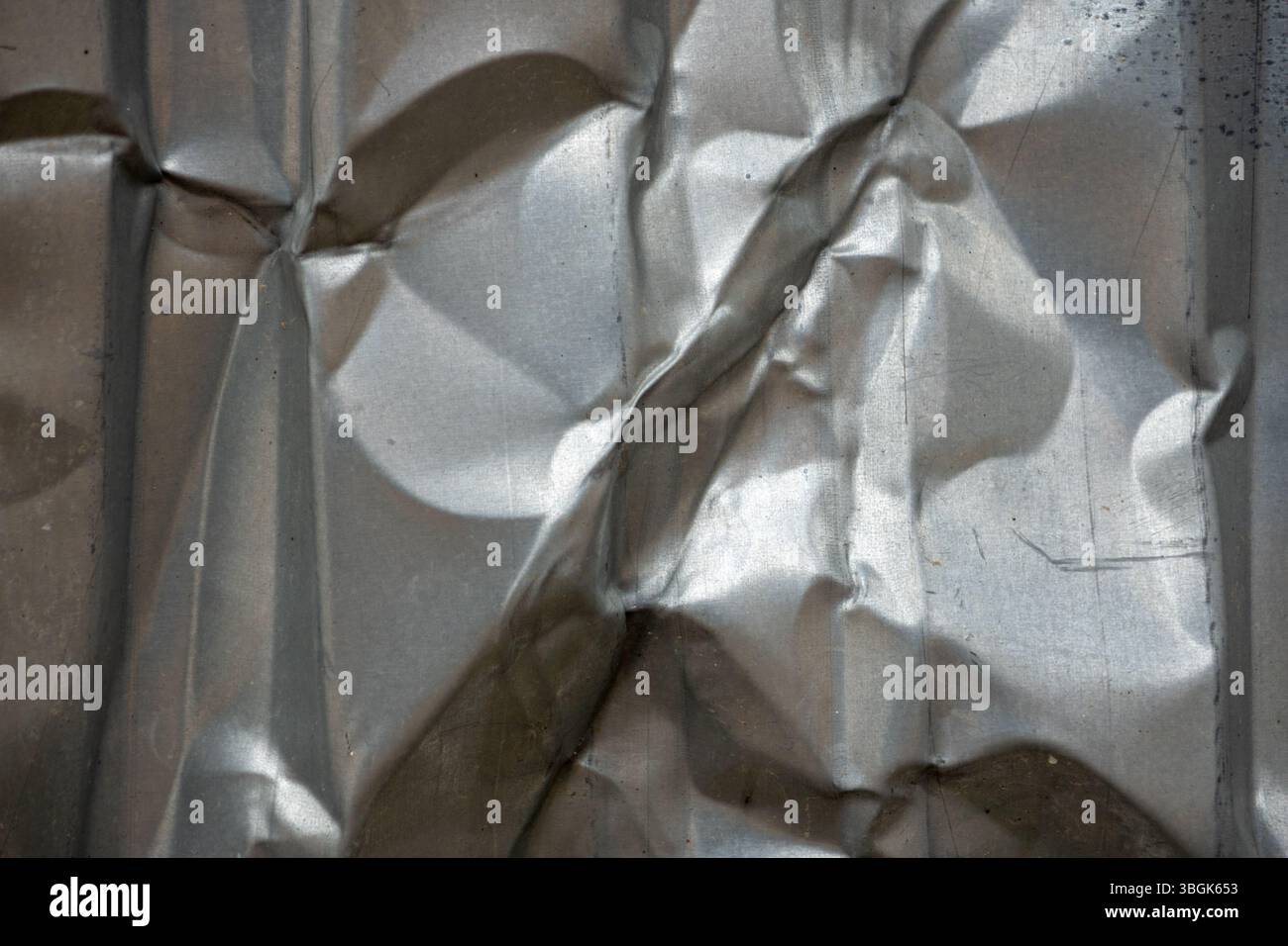 Textured metallic surface creating interesting visual patterns Stock Photo